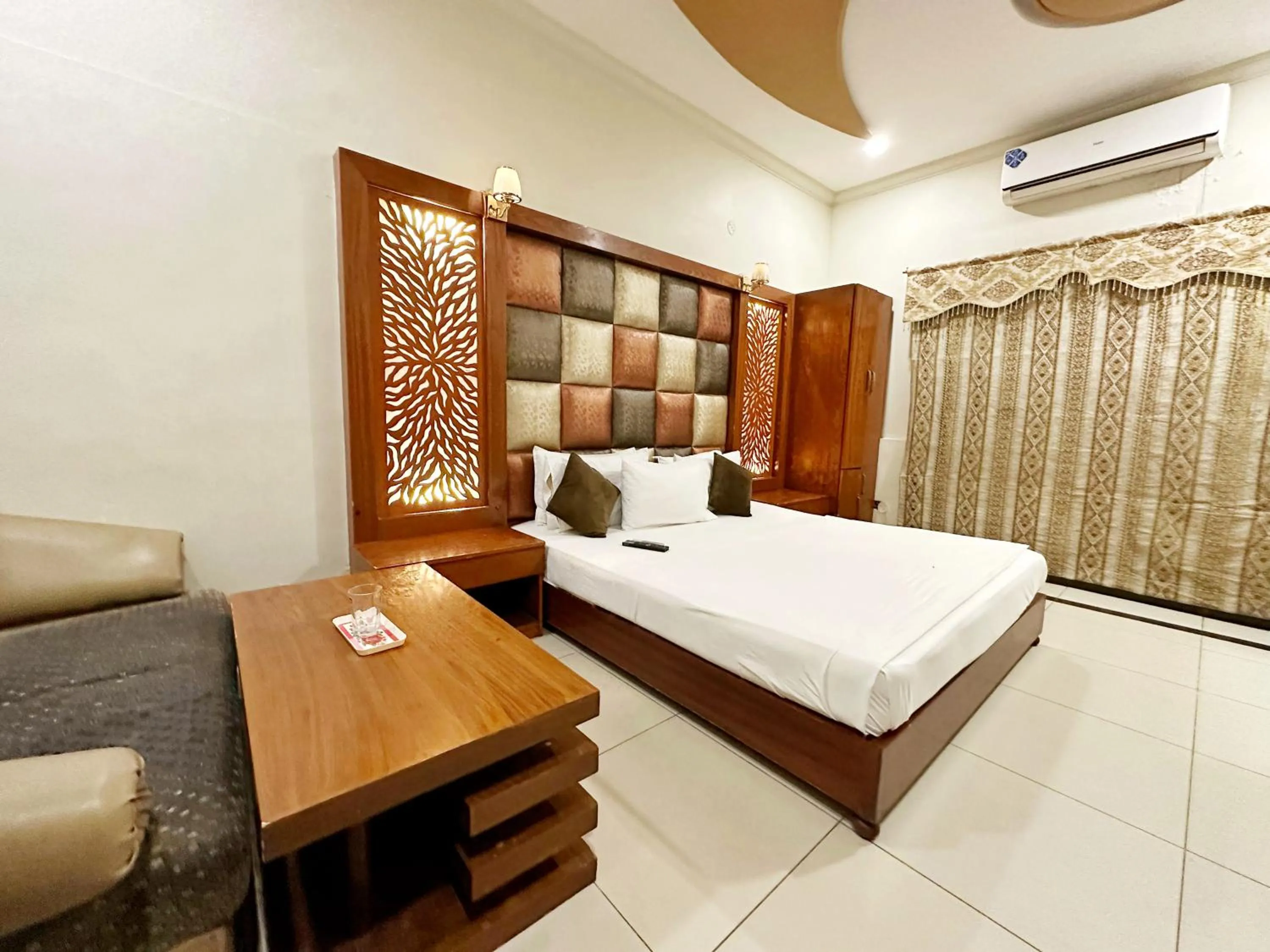 Bed in The Grand Hotel Multan