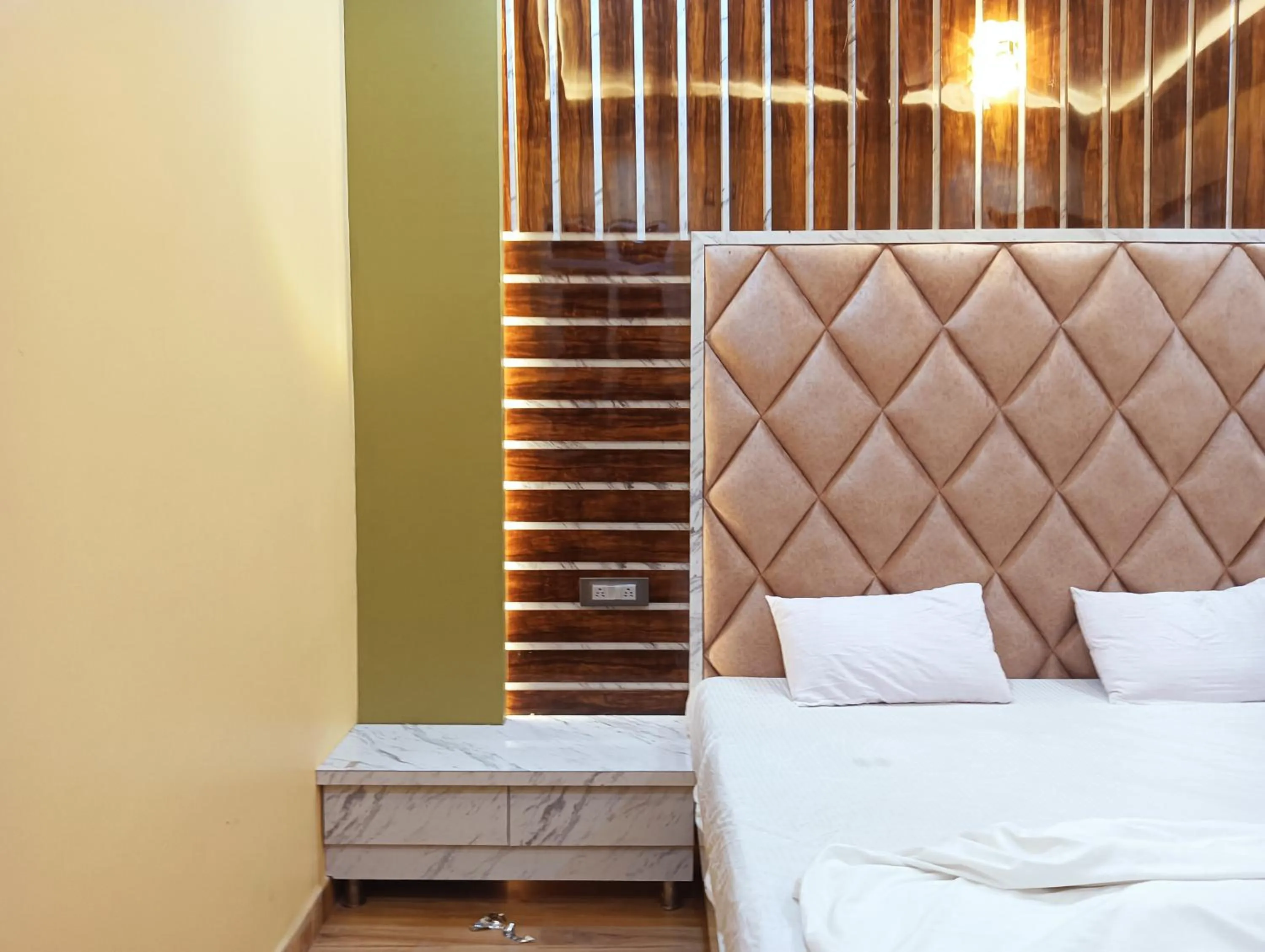 Bed in Hotel Ashok Vihar