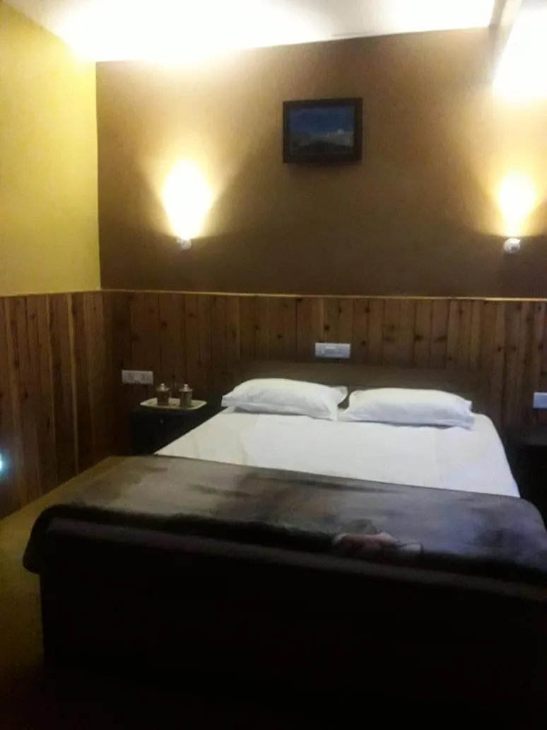 Bed in Hotel Happy Home