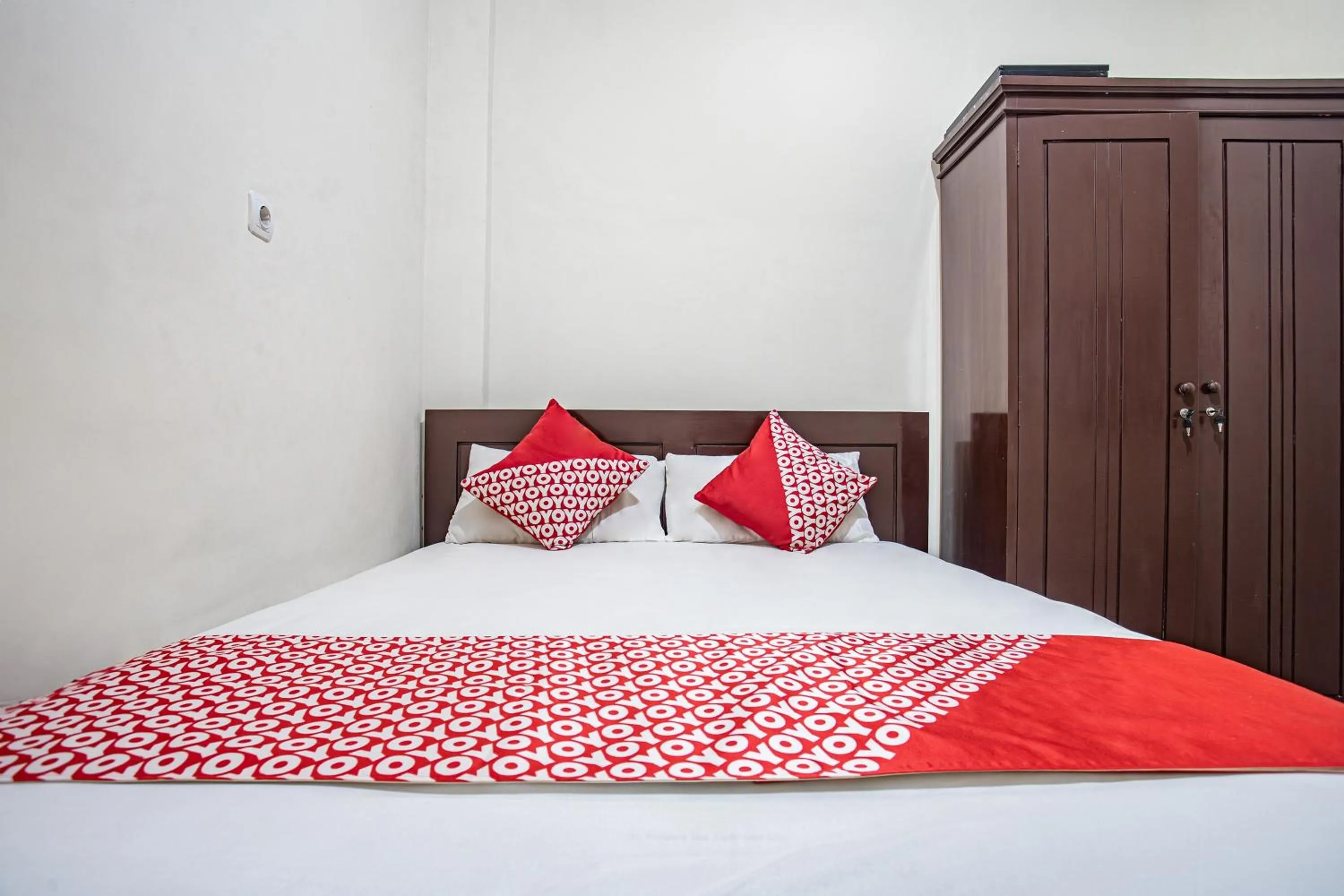 Bedroom in Hotel O Almahyra Guest House Syariah