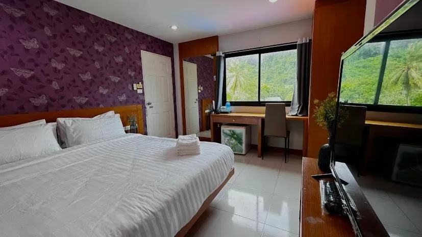 Photo of the whole room, Bed in Coco Mountain View Guest House Hotel