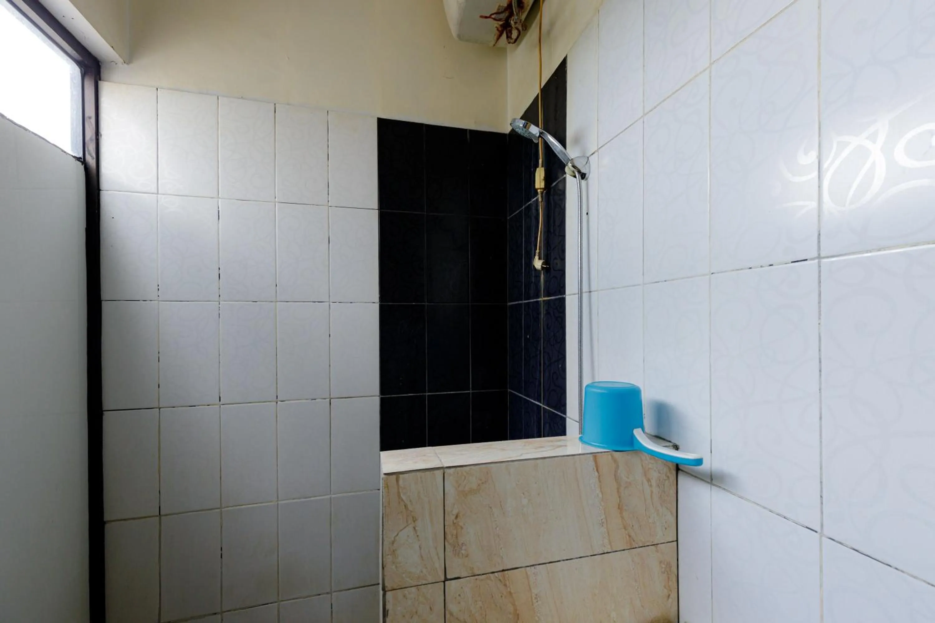 Bathroom in Urbanview SRB near Mall Ciputra Cibubur by RedDoorz