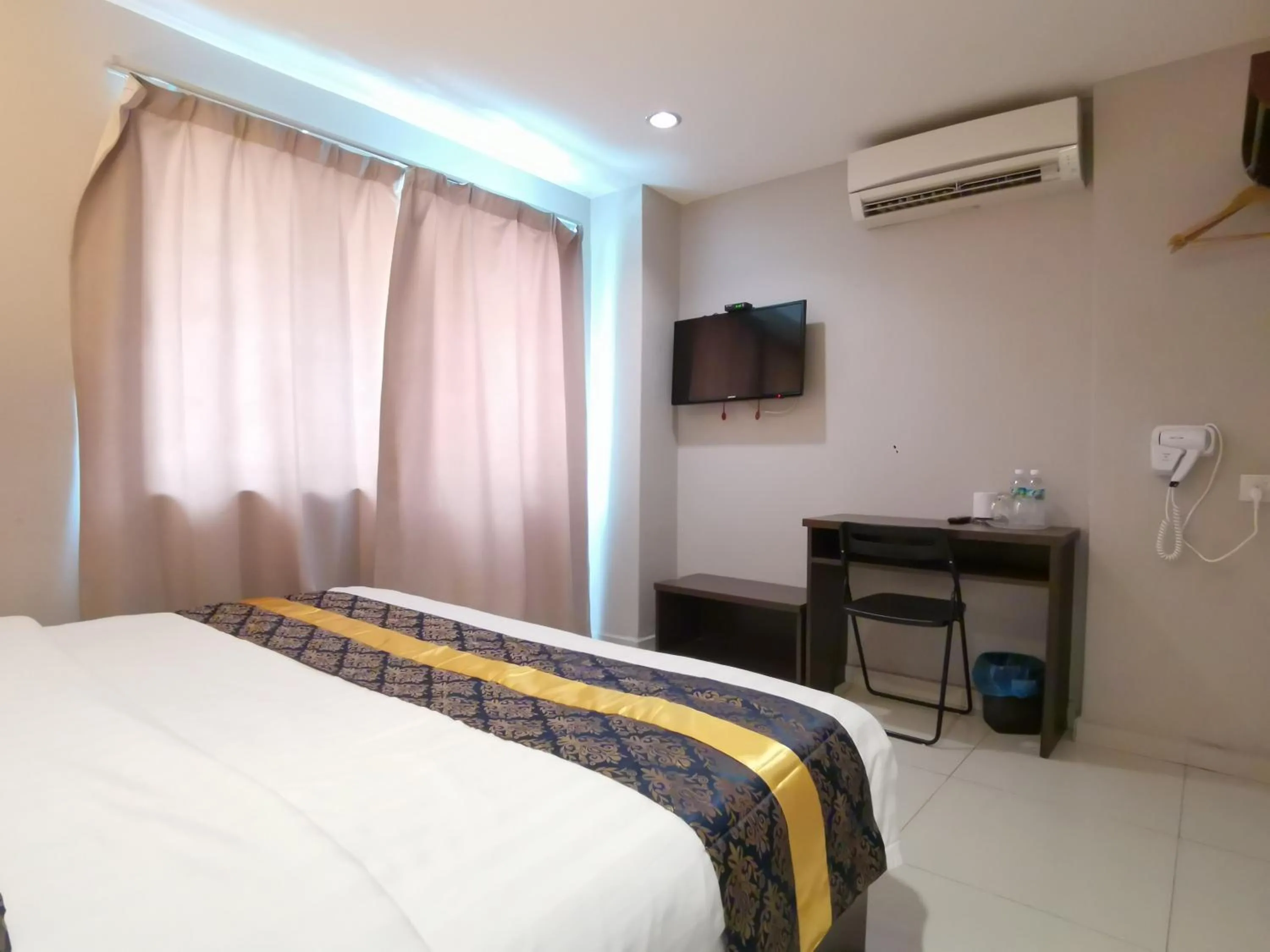 Bed in Star Bay Hotel