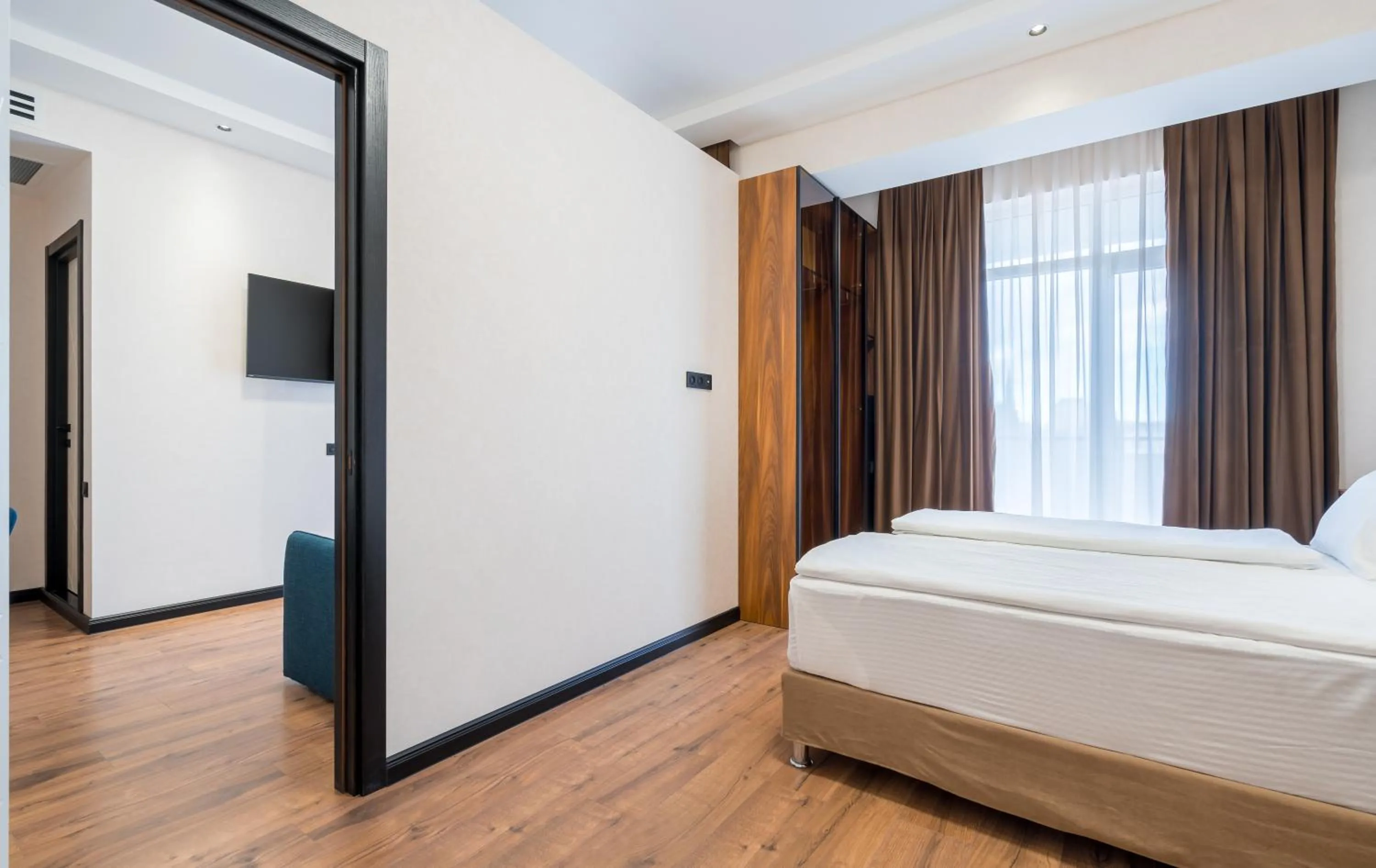 Communal lounge/ TV room, Bed in Olympus Hotel By Umbrella