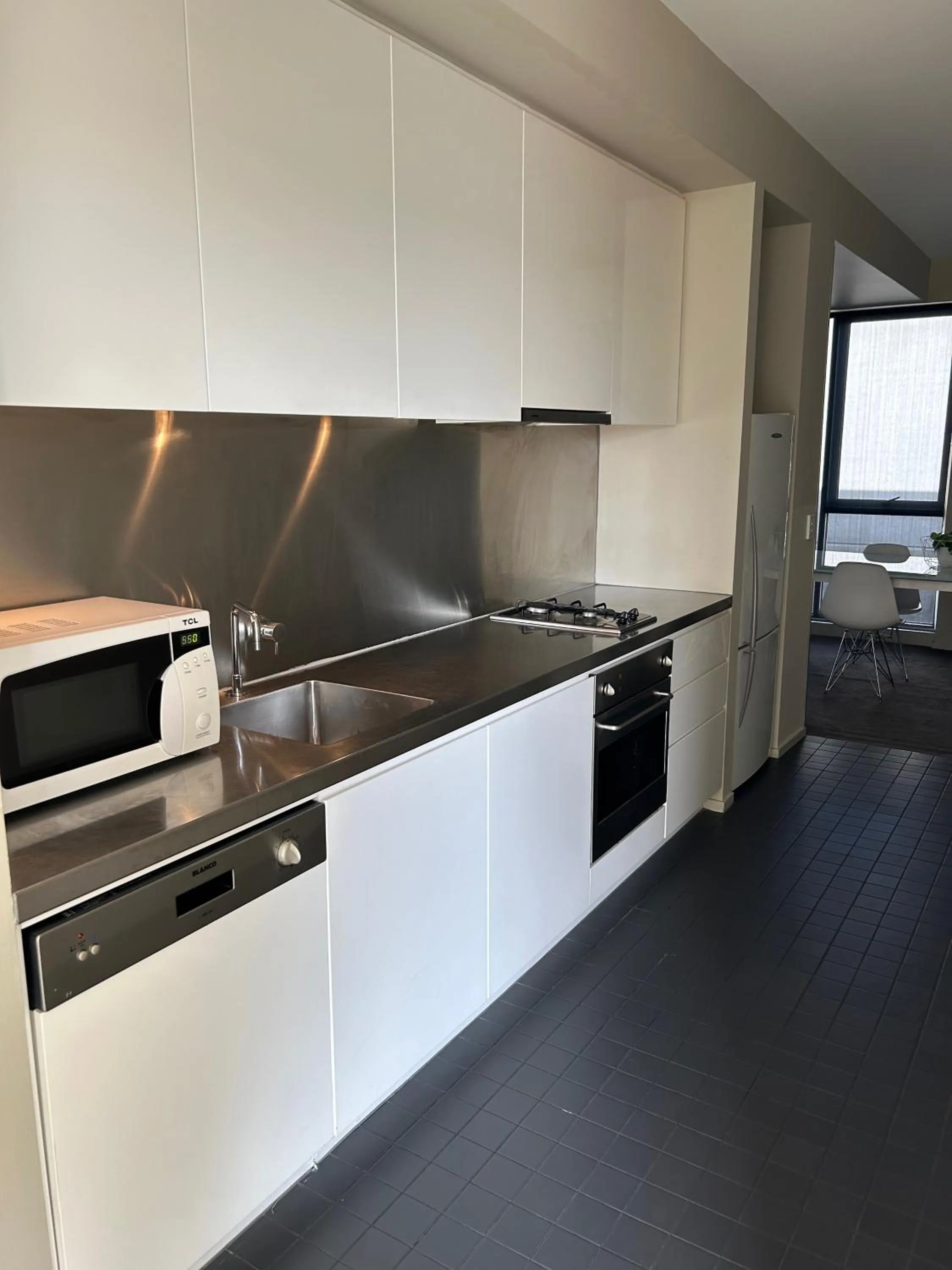 Kitchen or kitchenette in Adele Apartment Hotel East Melbourne