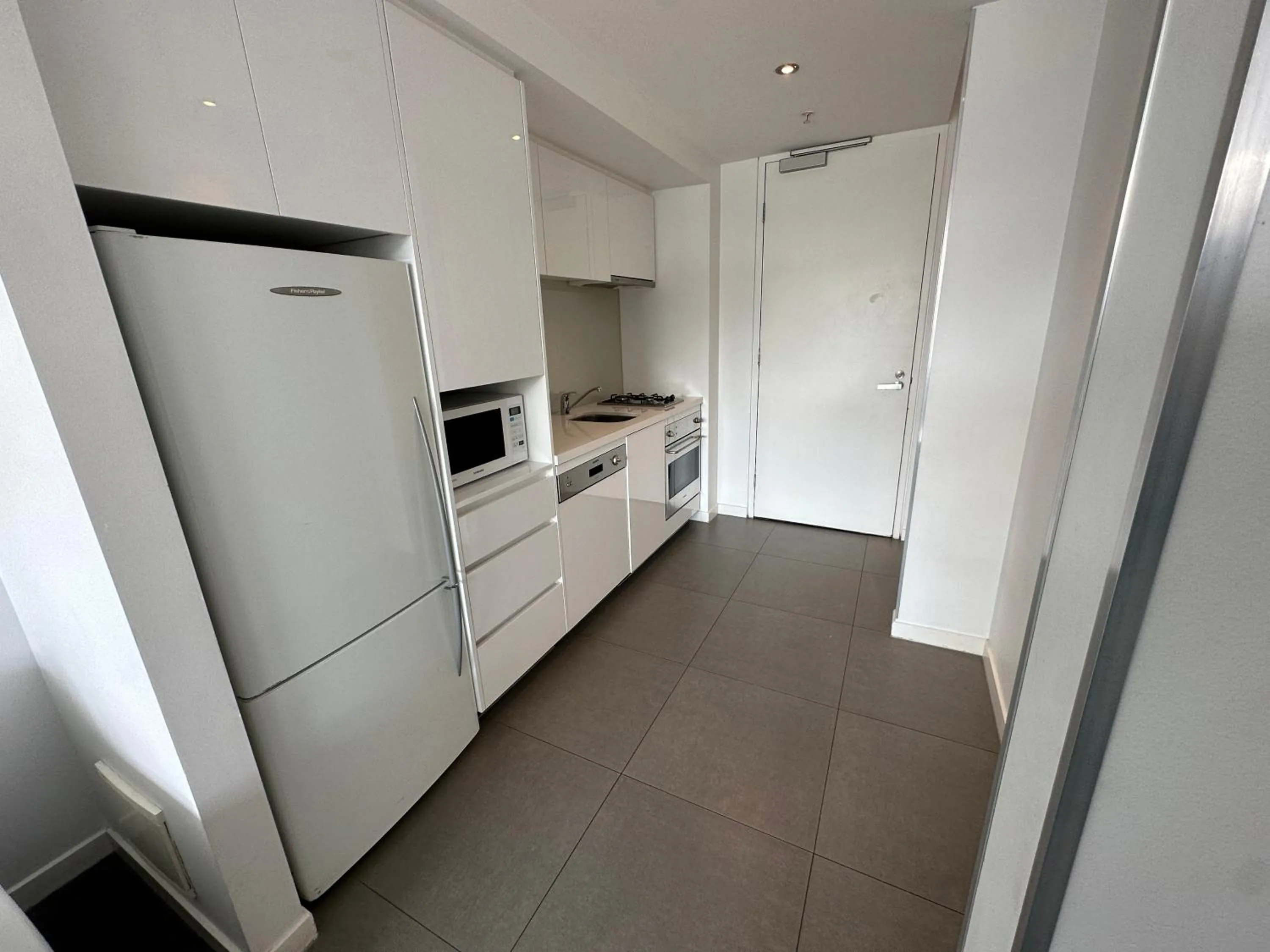 Kitchen or kitchenette in Adele Apartment Hotel East Melbourne