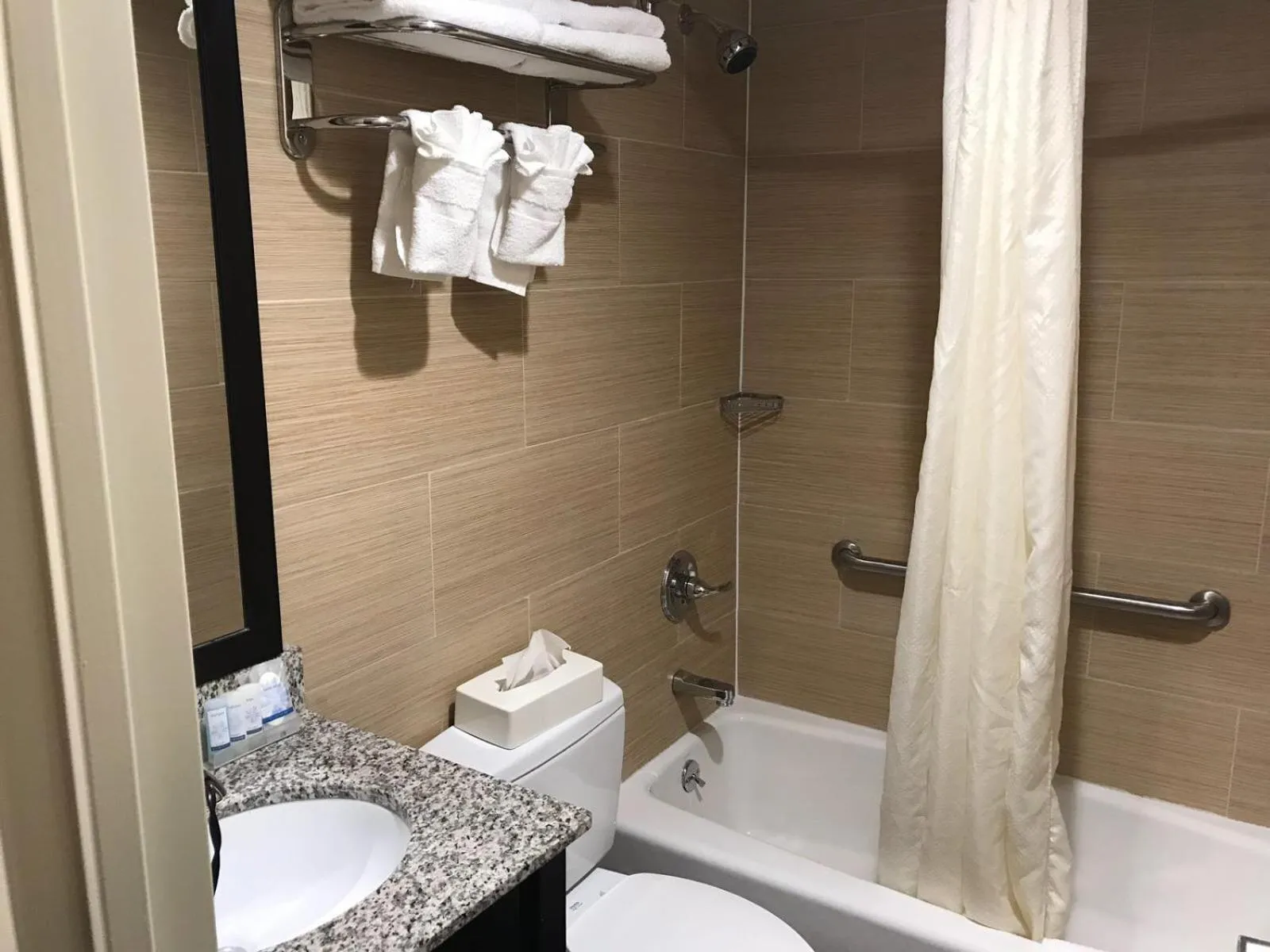 Bathroom in Days Inn by Wyndham Brooklyn Borough Park