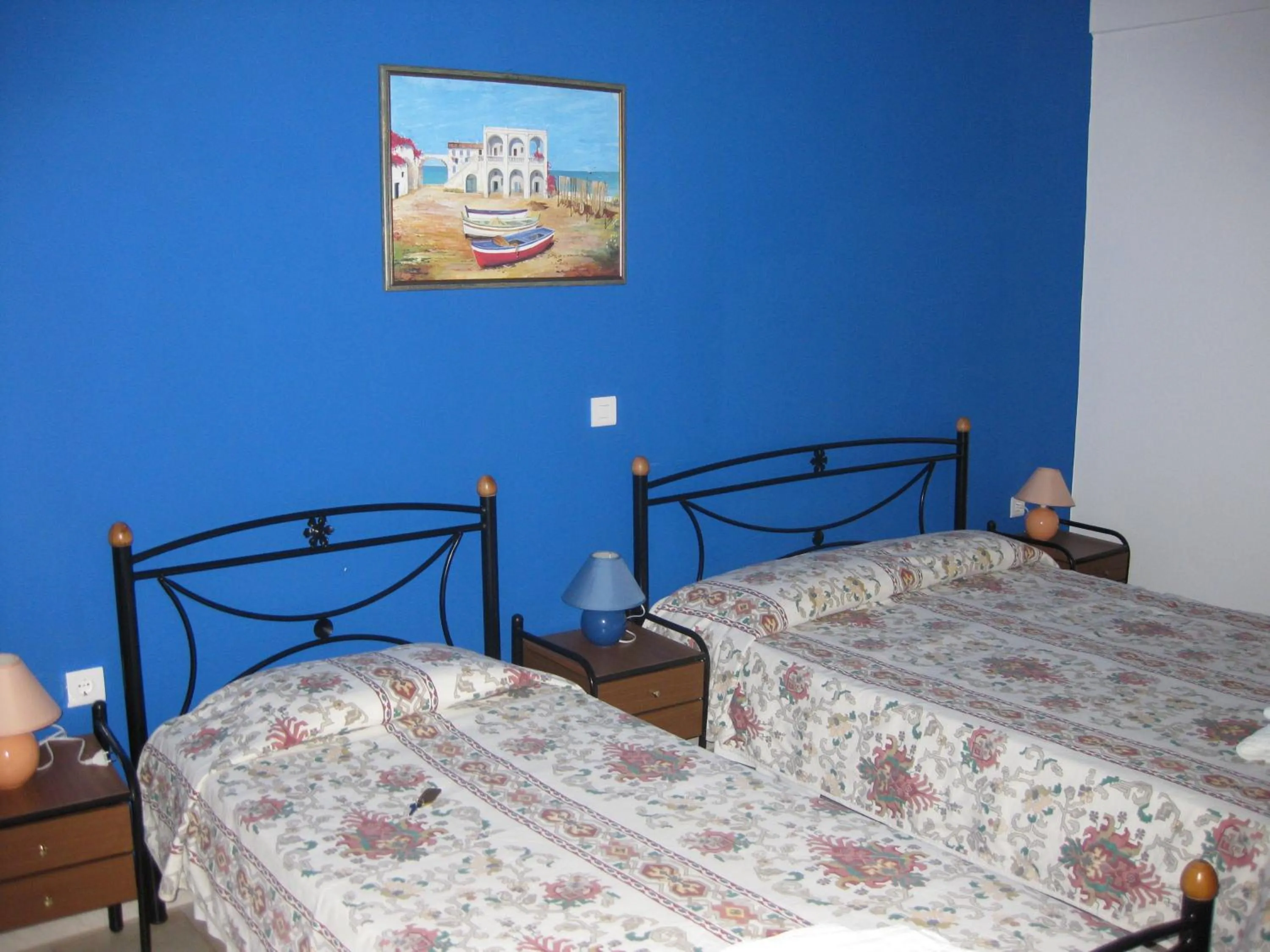 Bed in Calypso Hotel