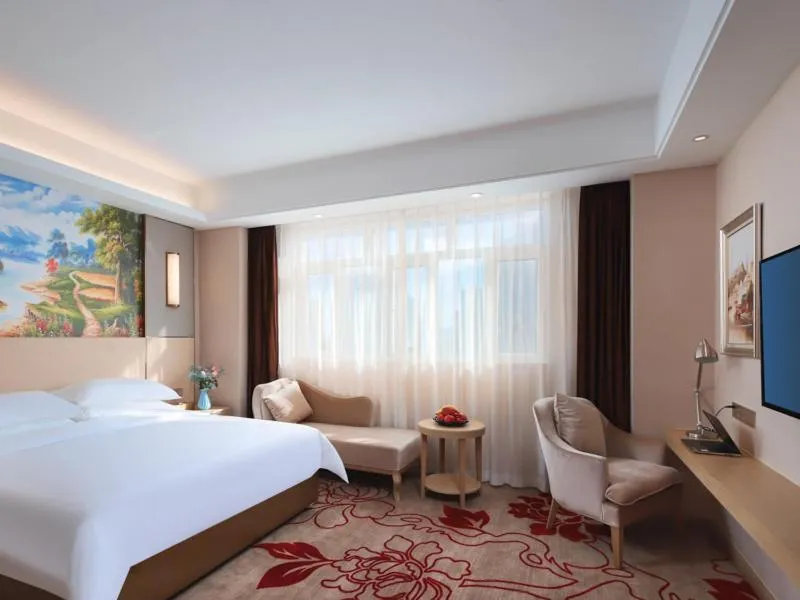 Bed in Vienna International Hotel FuJian PuTian Pearl
