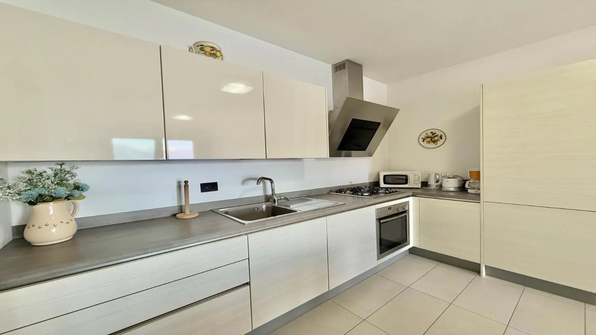 Kitchen or kitchenette in Residence degli Oleandri 6A