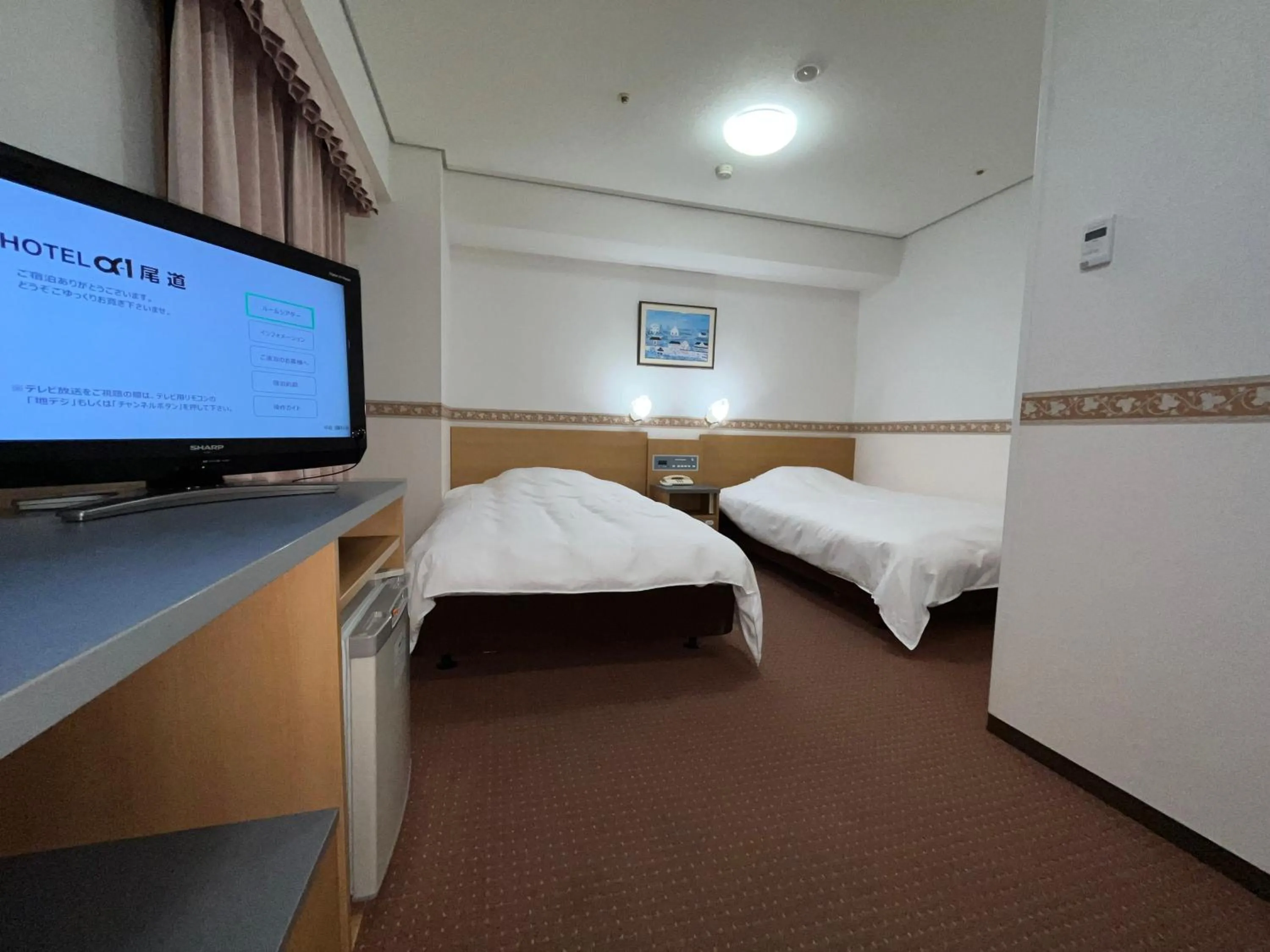 Bed in Hotel Alpha-One Onomichi