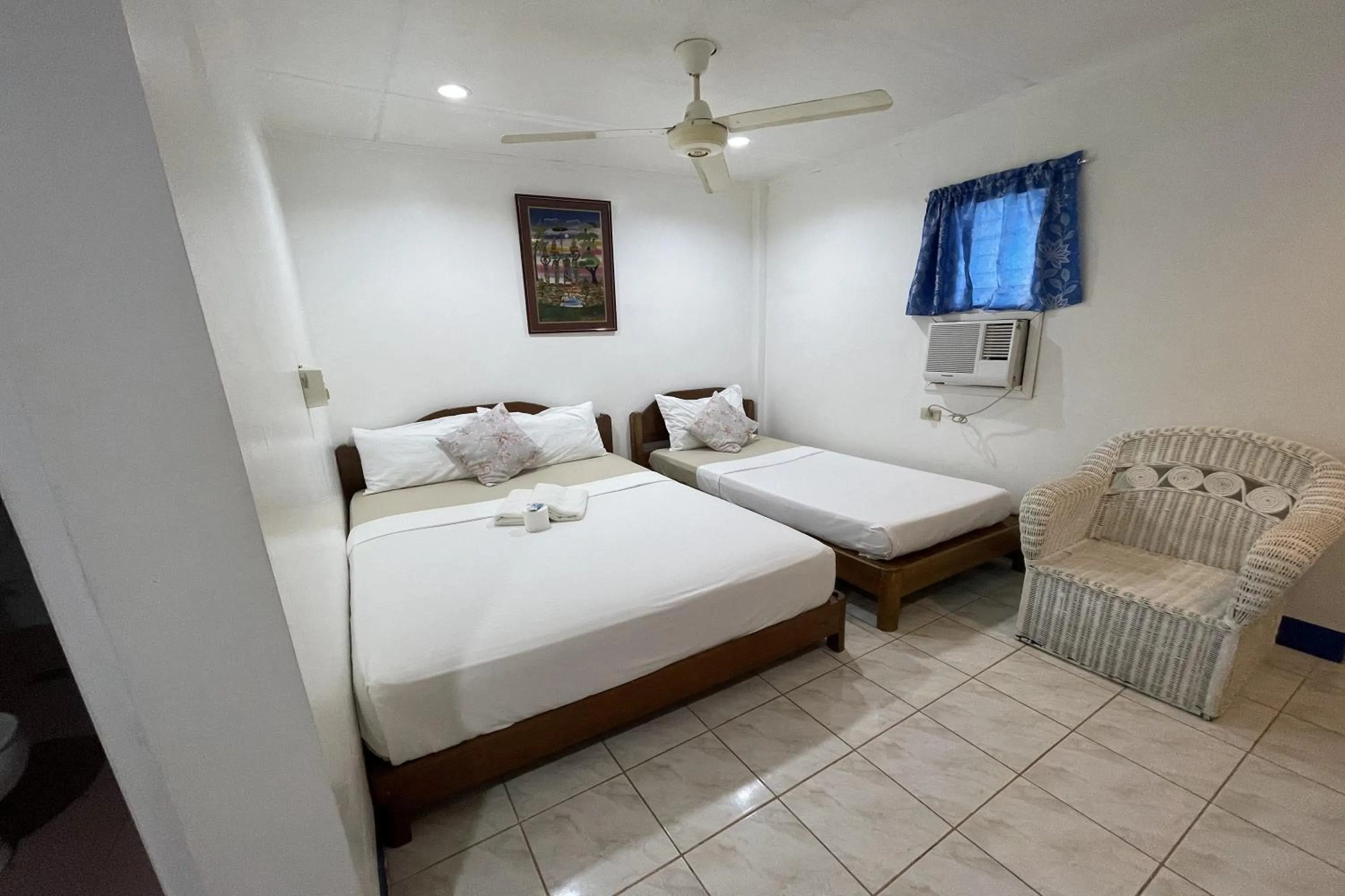 Photo of the whole room, Bed in Casa de Praxides Tourist Inn Palawan