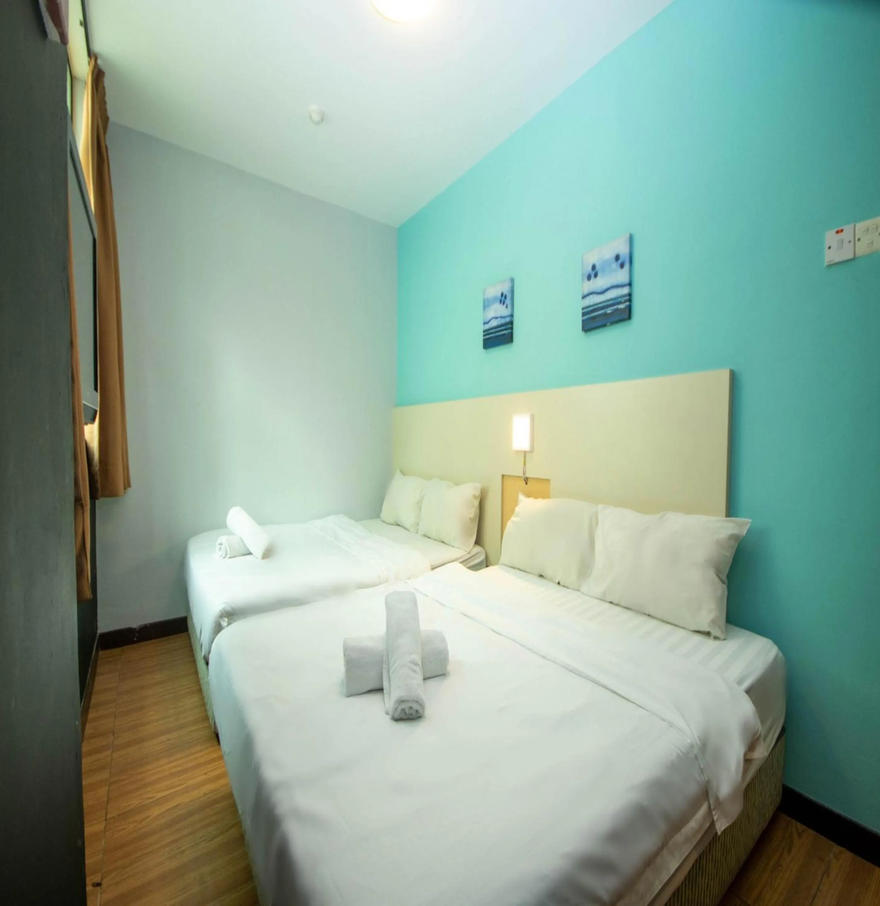 Bed in JQ Station Eight Inn