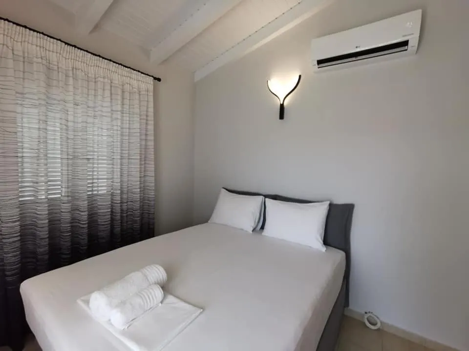 Bed in Ionion Beach Apartment Hotel & Spa