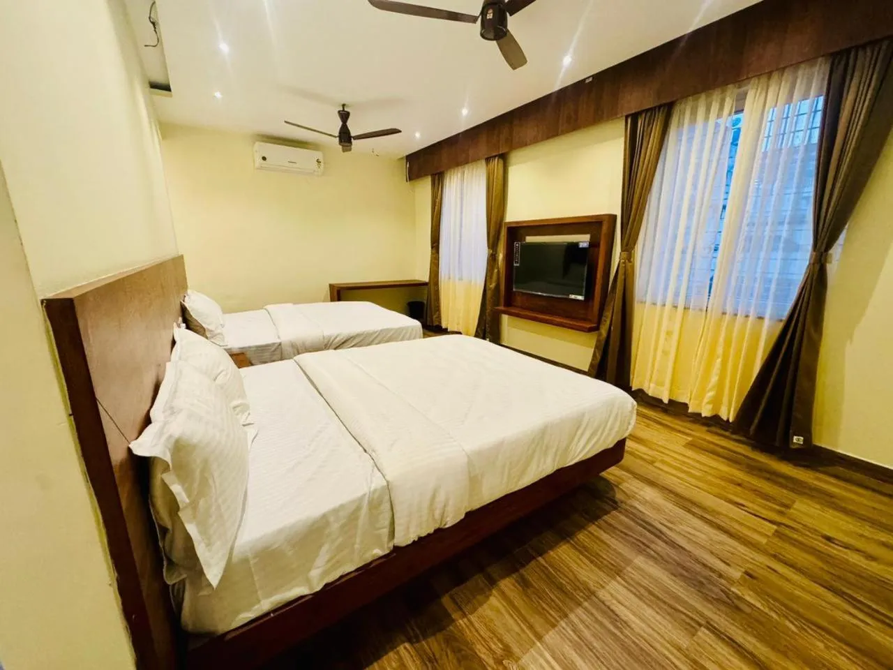 Bed in S K Legacy Hotel