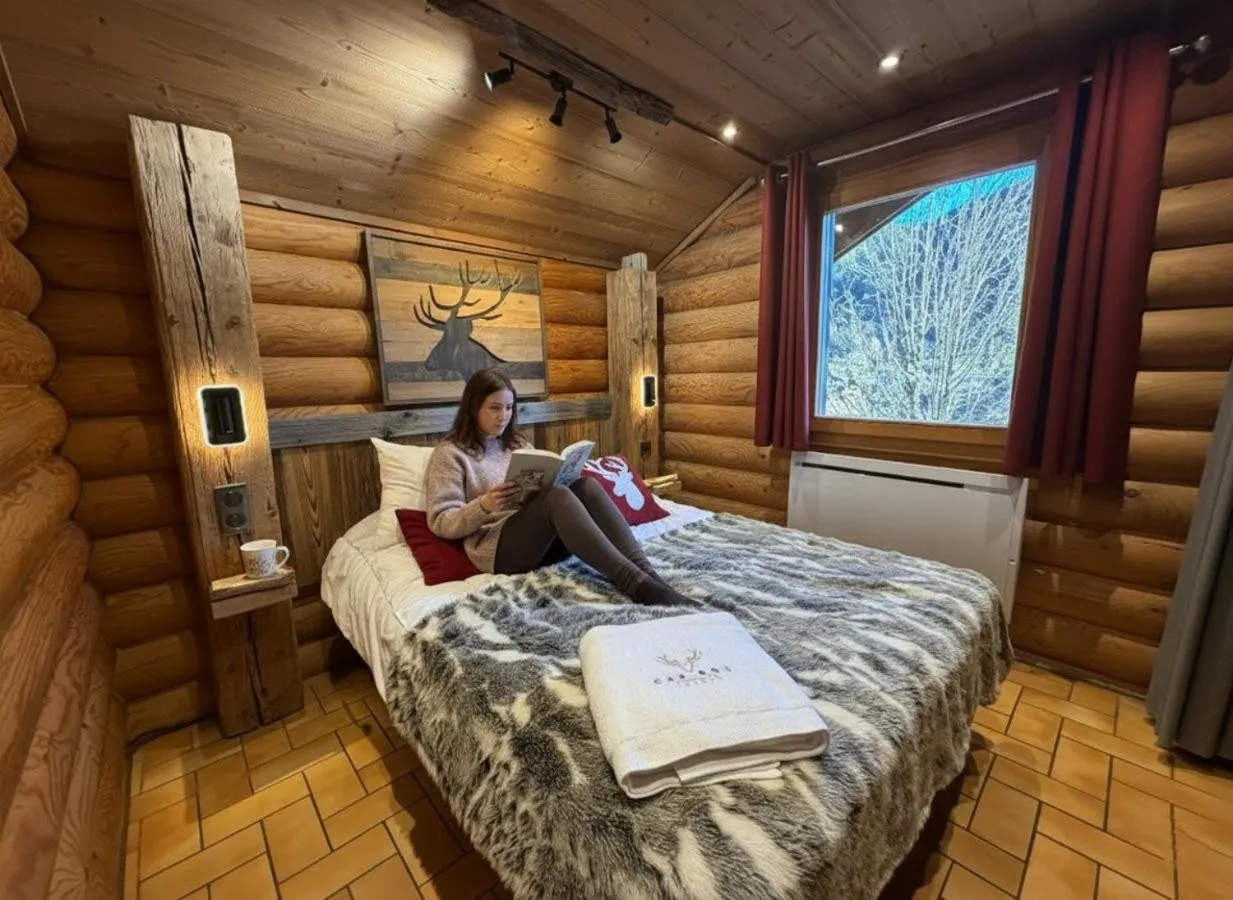 Bed in LE GRAND CERF Chalet en rondins avec SPA Jacuzzi