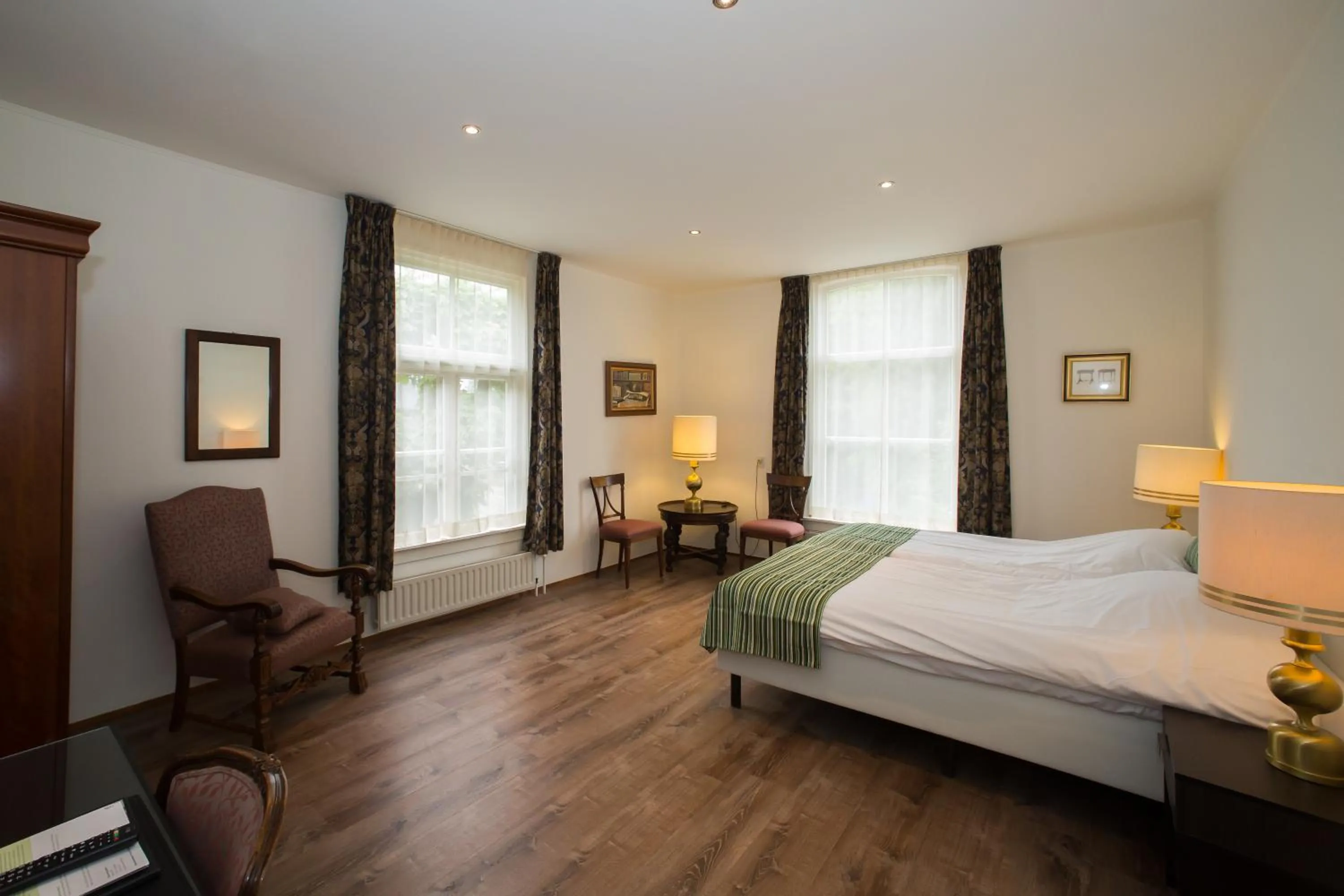 Photo of the whole room, Bed in Landhotel De Hoofdige Boer