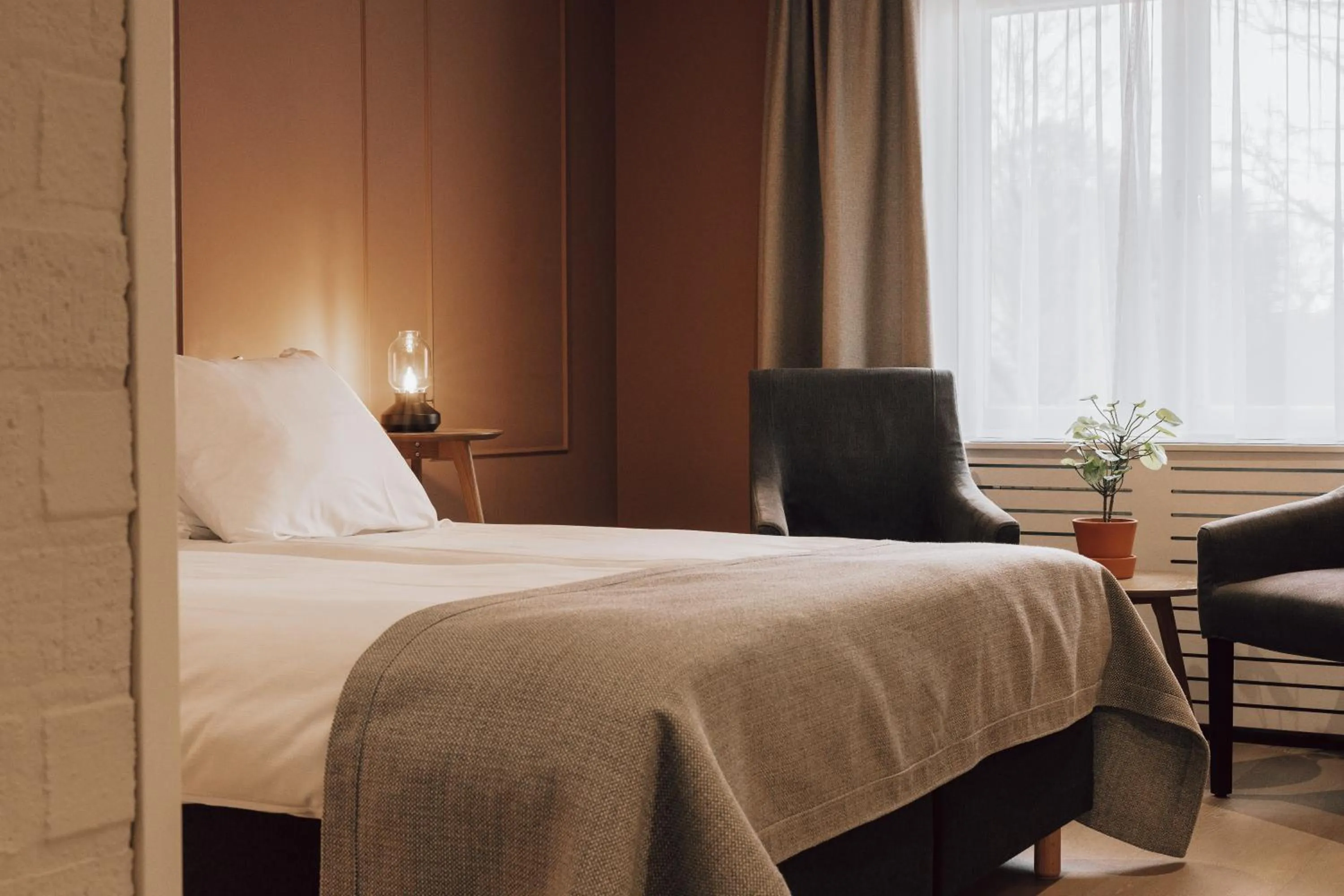 Bed in Landhotel De Hoofdige Boer