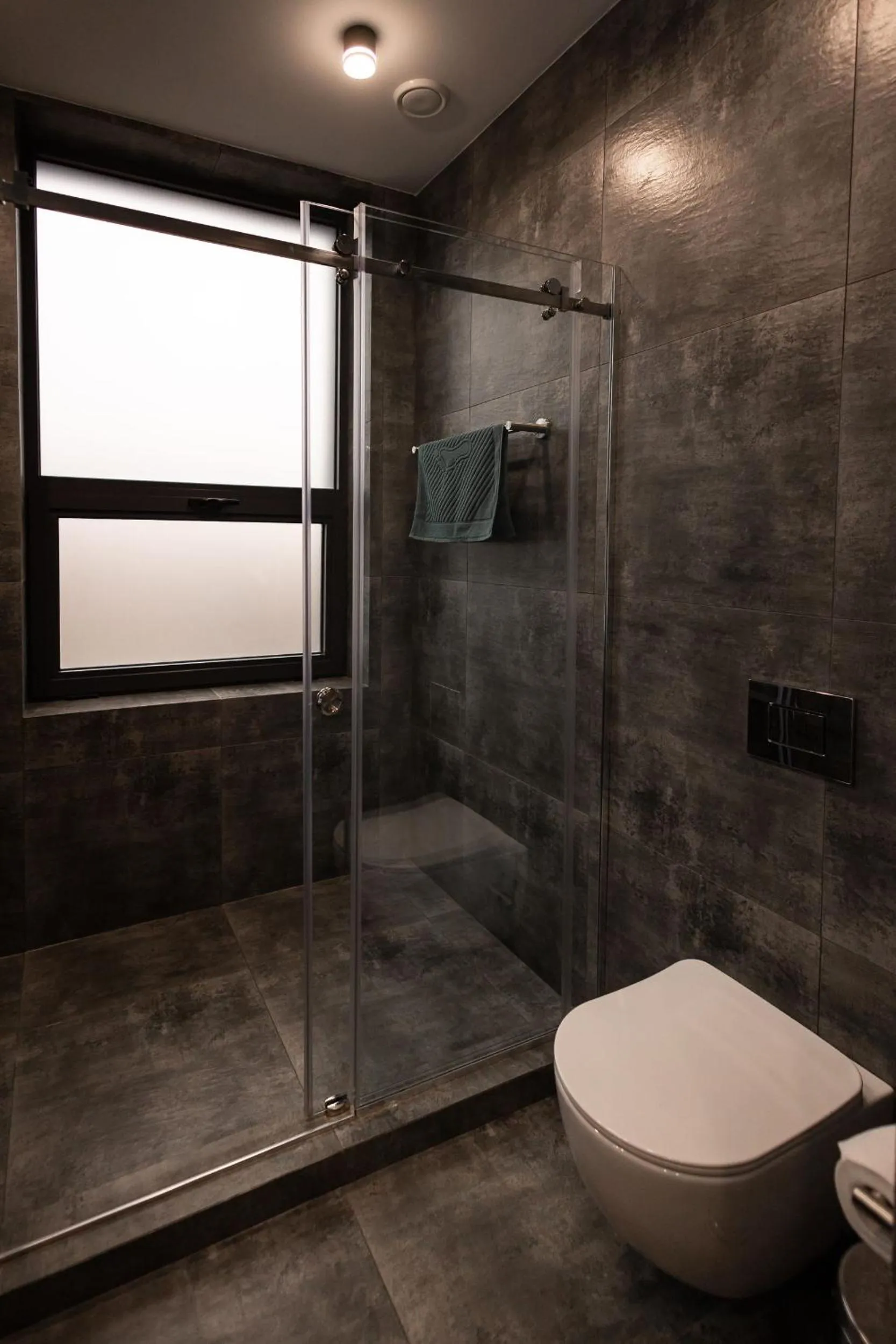 Toilet in Aston Hotel