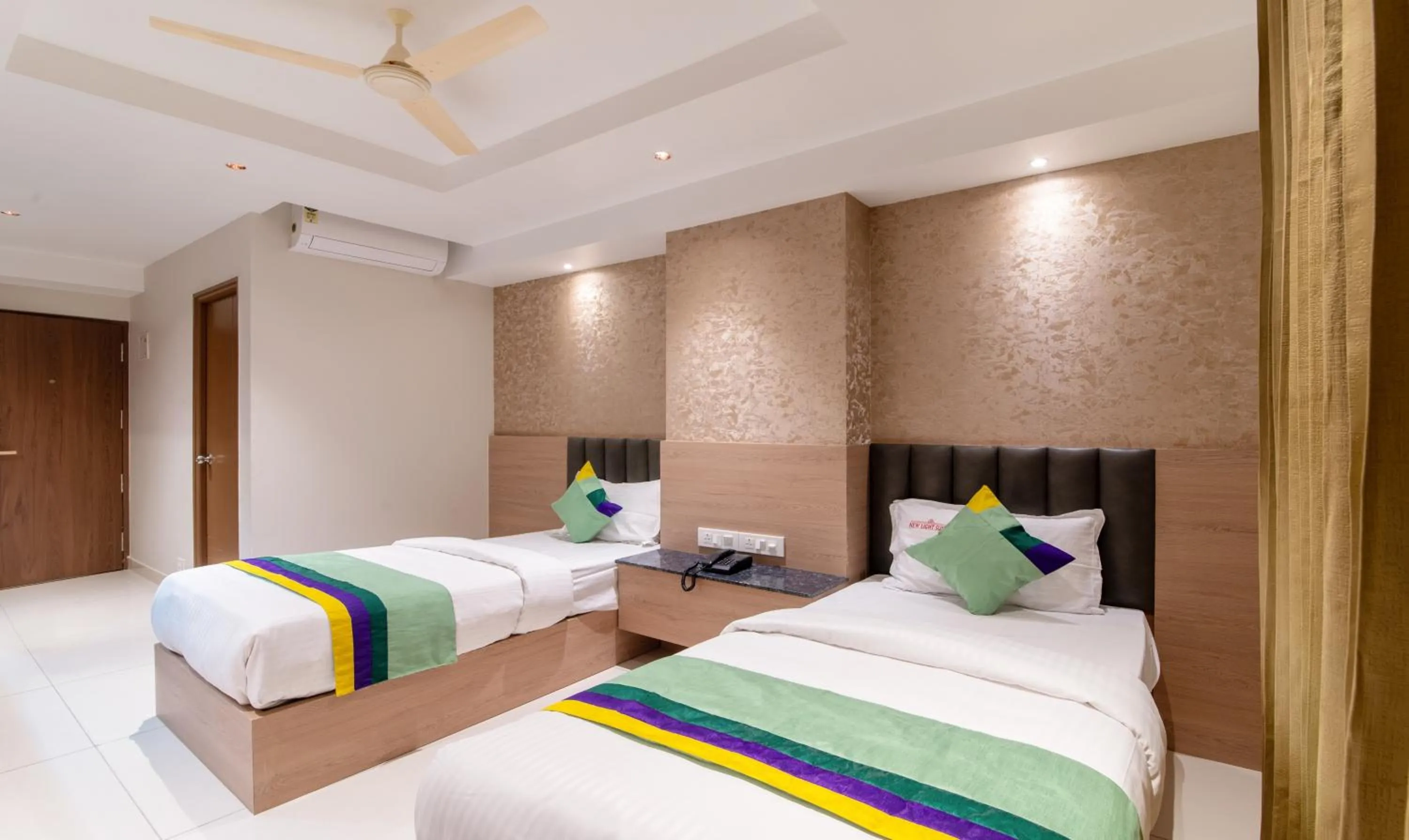 Bedroom, Bed in Treebo Premium New Light Suites