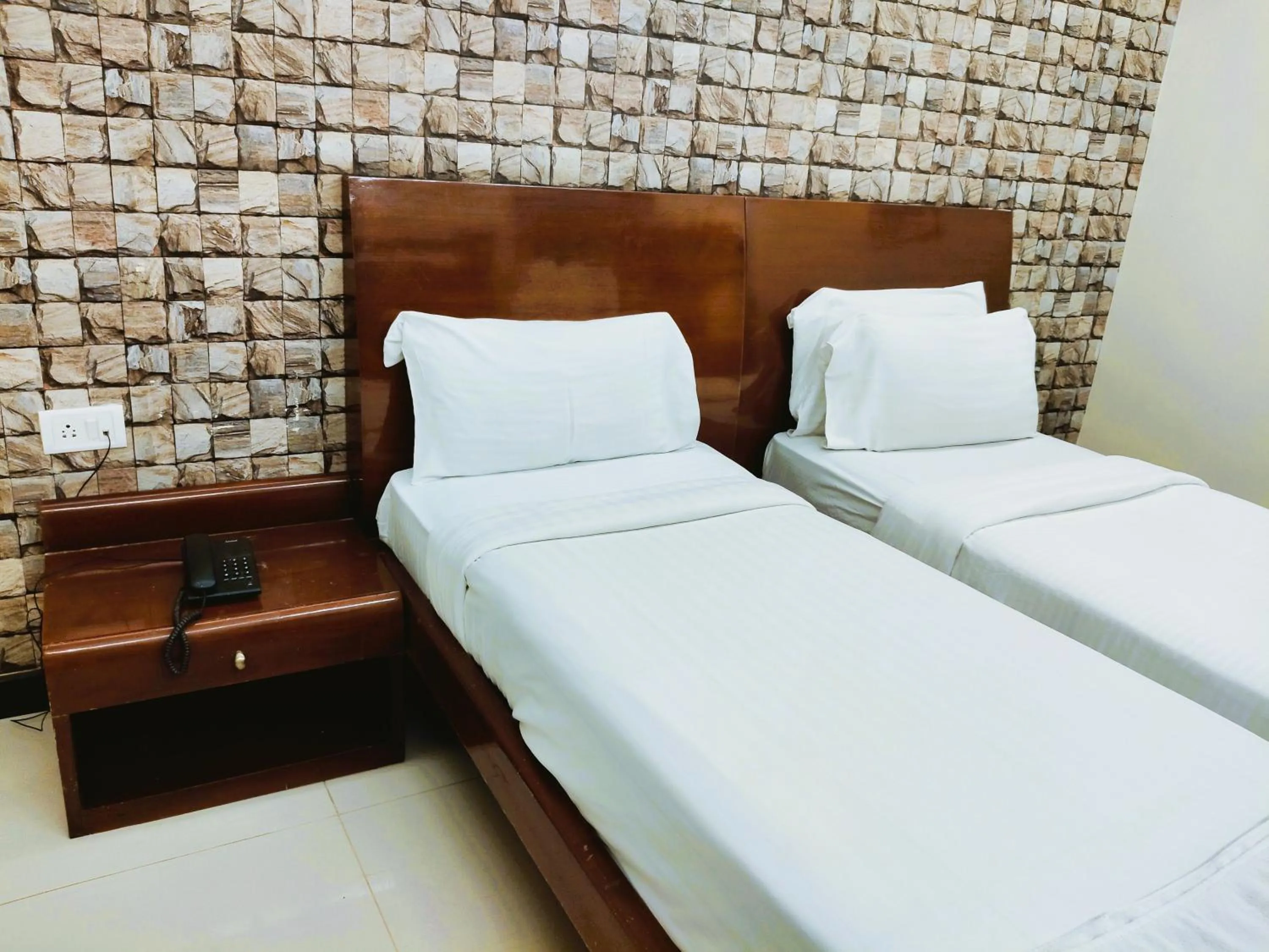 Bed in Athasri Hotel Infantry Road