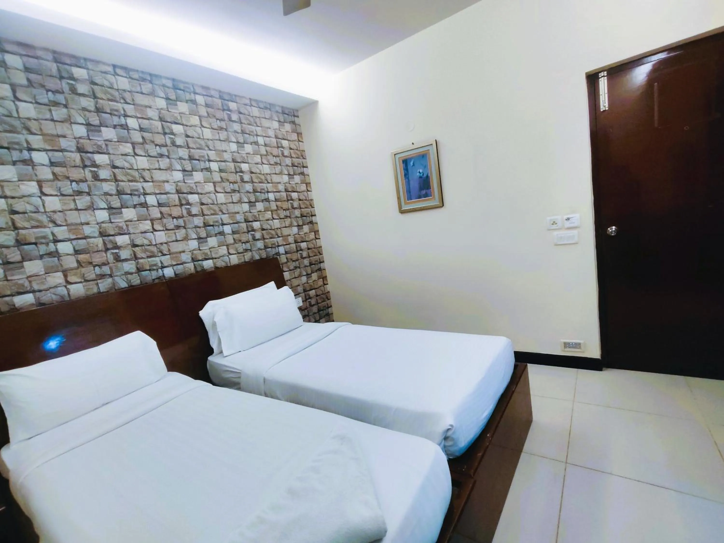 Bed in Athasri Hotel Infantry Road