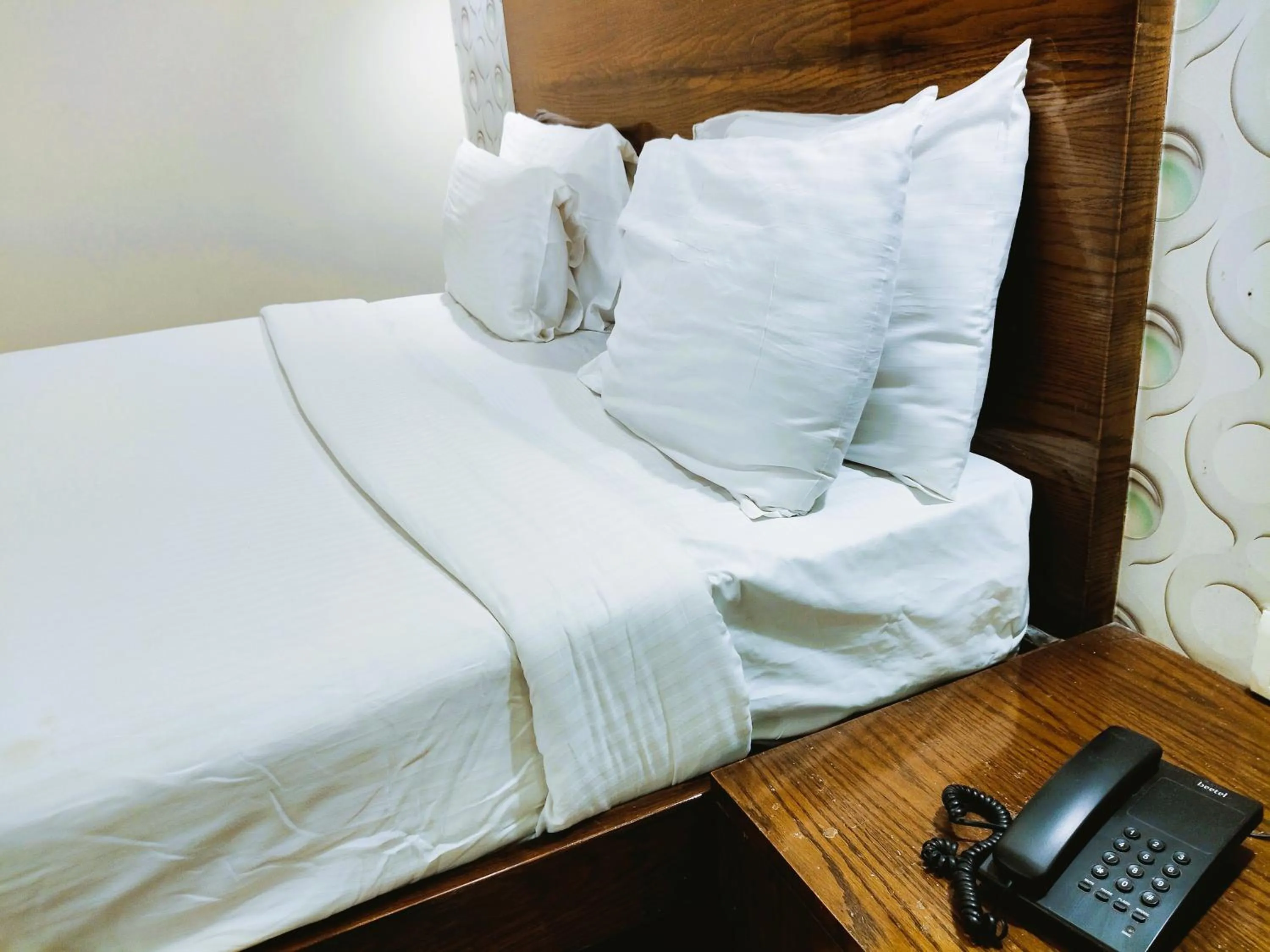 Bed in Athasri Hotel Infantry Road