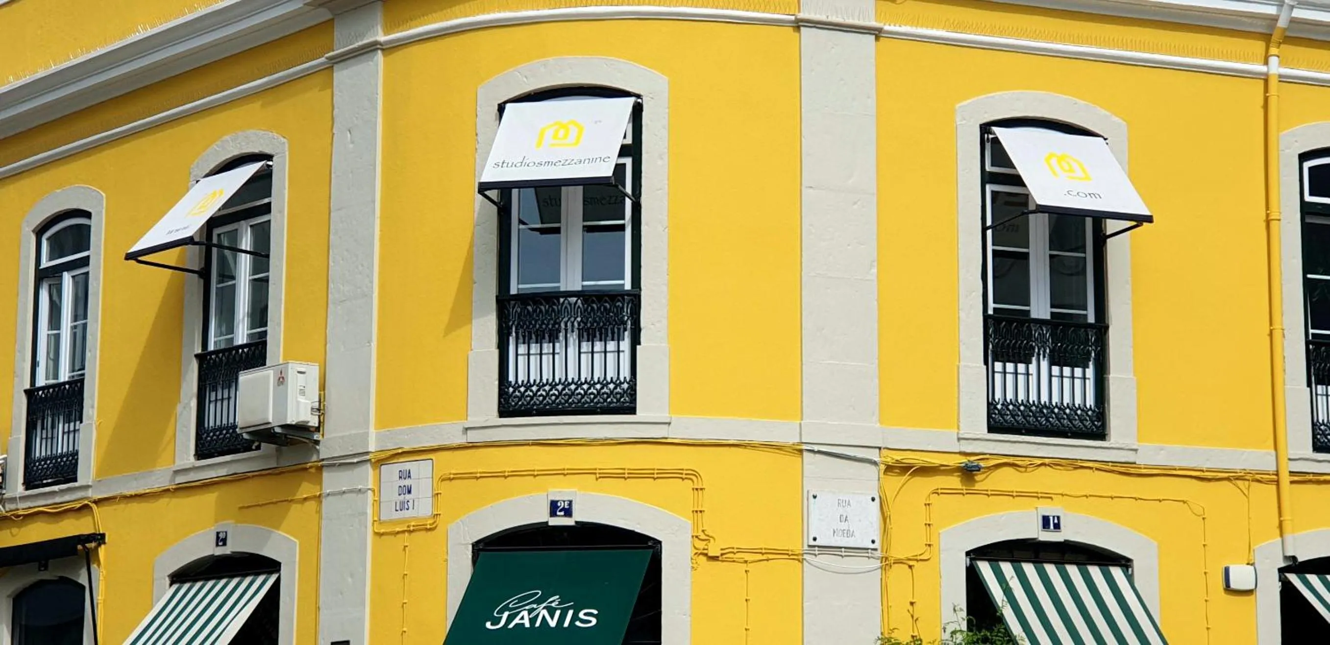 Property logo or sign in Studios with Mezzanine Rua da Moeda