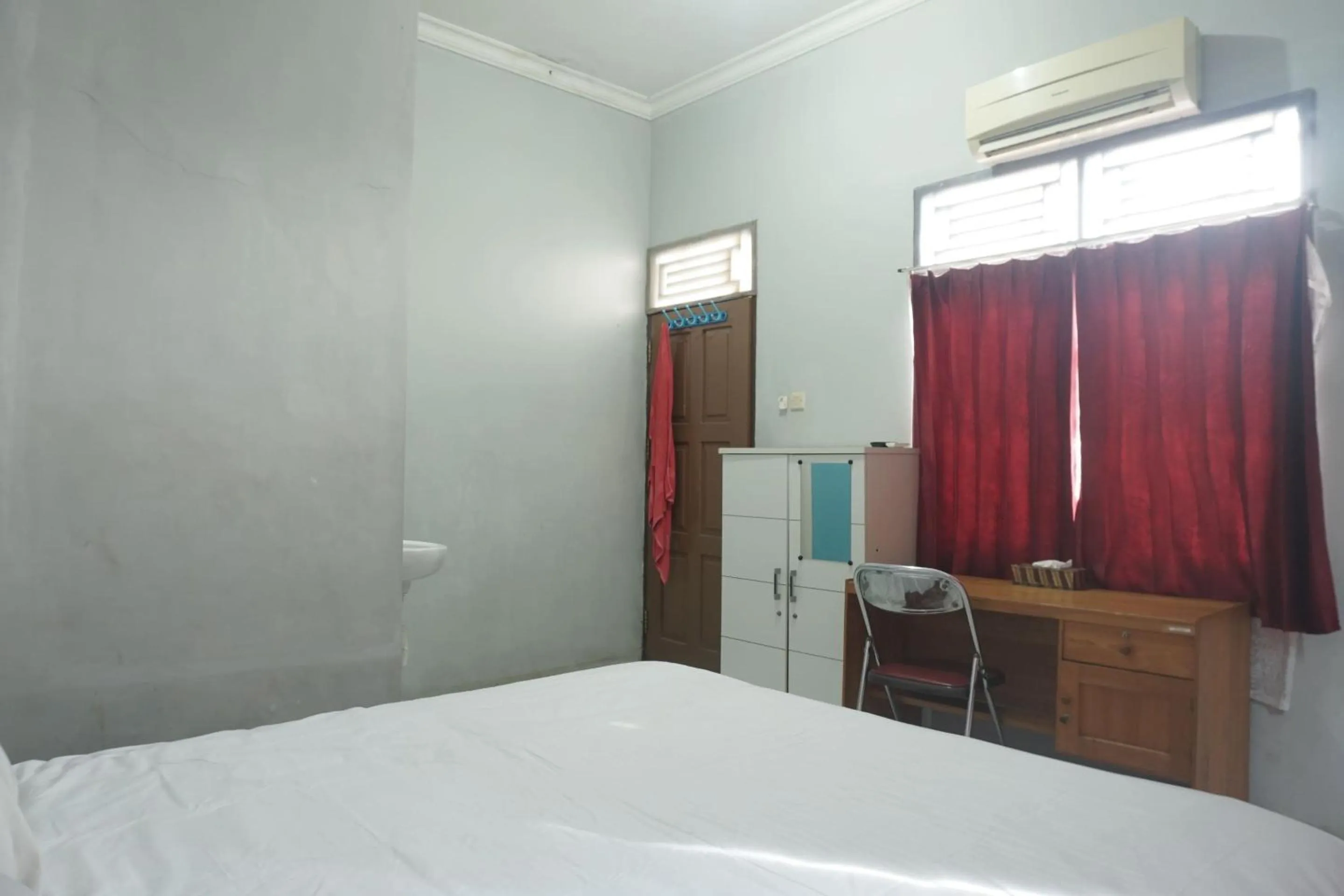 Bedroom in Hotel O Guest House Zidan 21