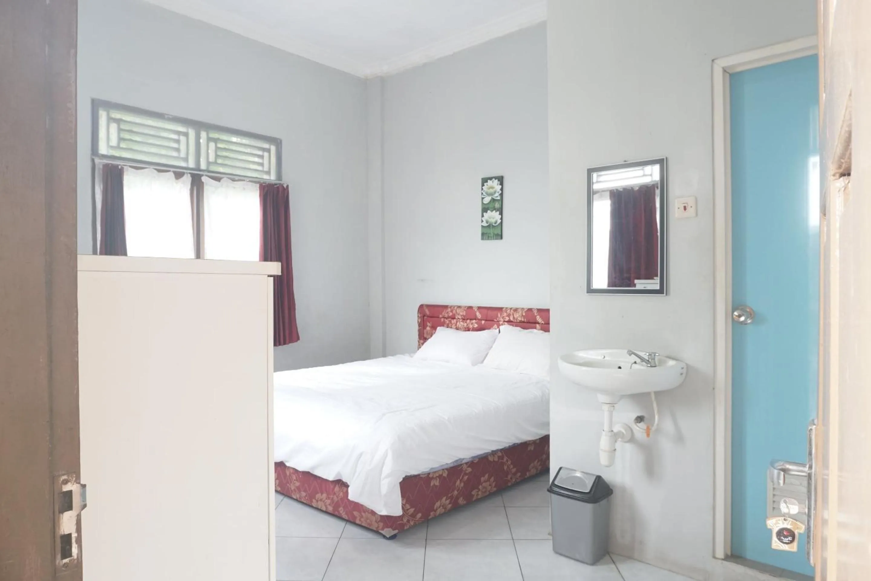 Bedroom in Hotel O Guest House Zidan 21