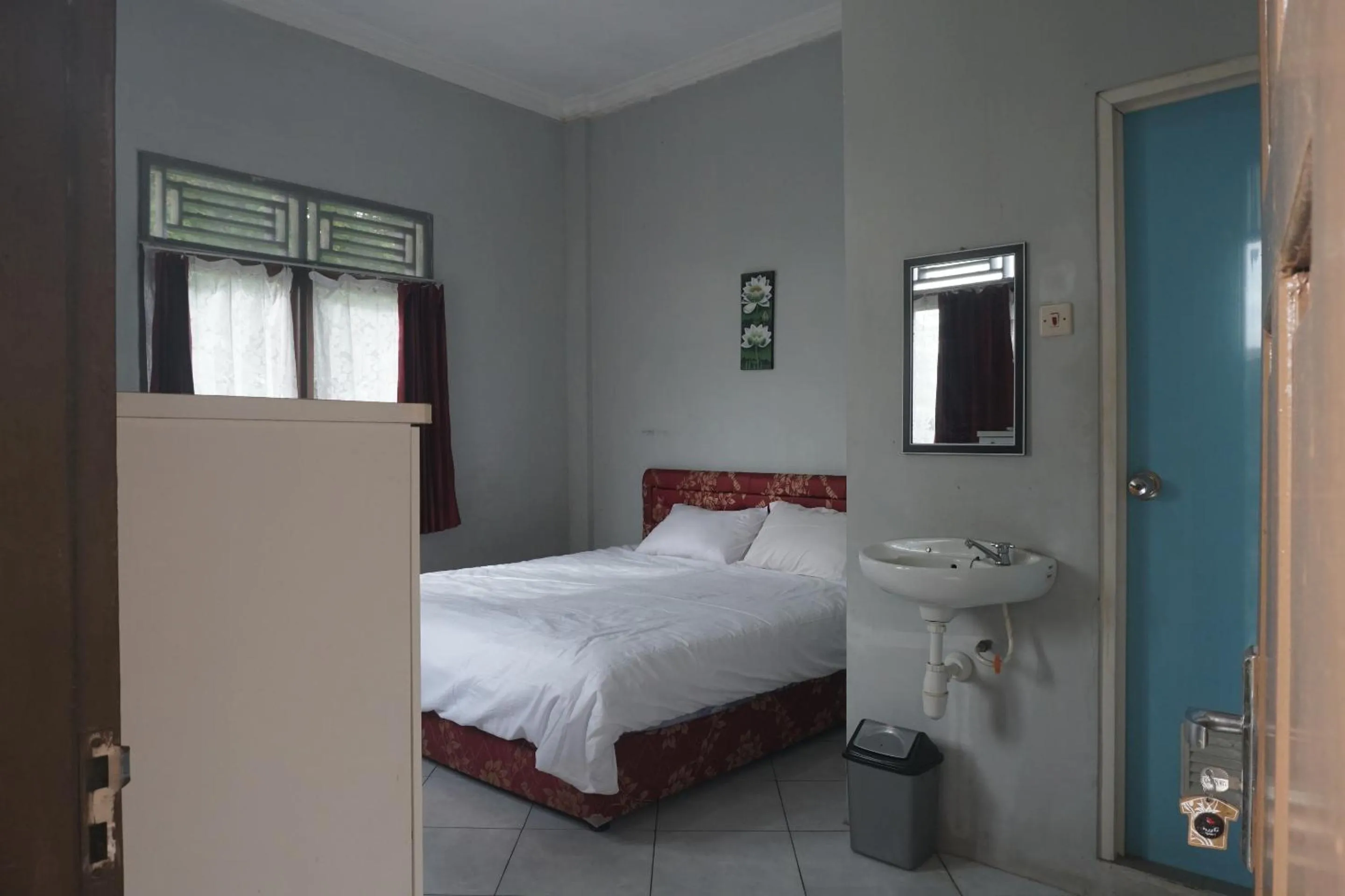Bedroom in Hotel O Guest House Zidan 21