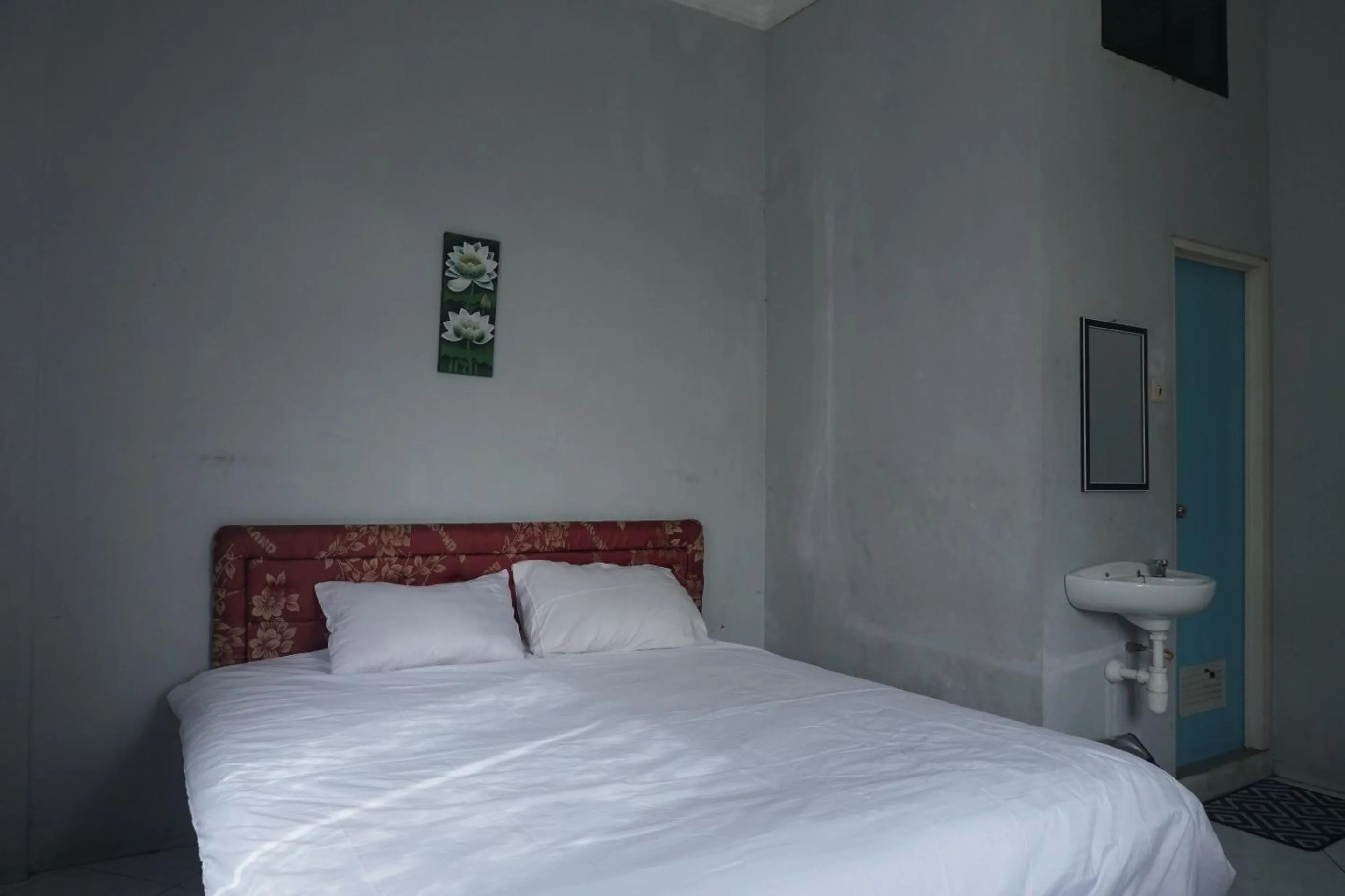 Bedroom in Hotel O Guest House Zidan 21