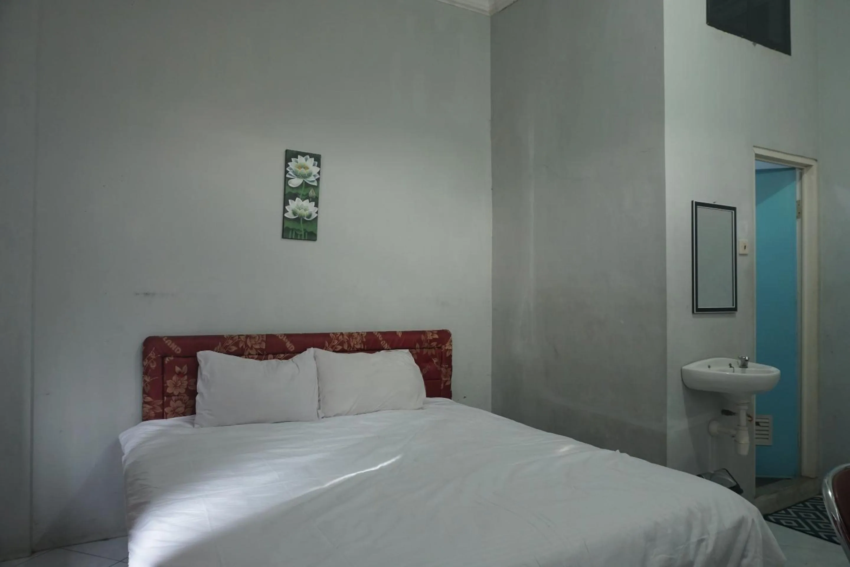 Bedroom in Hotel O Guest House Zidan 21