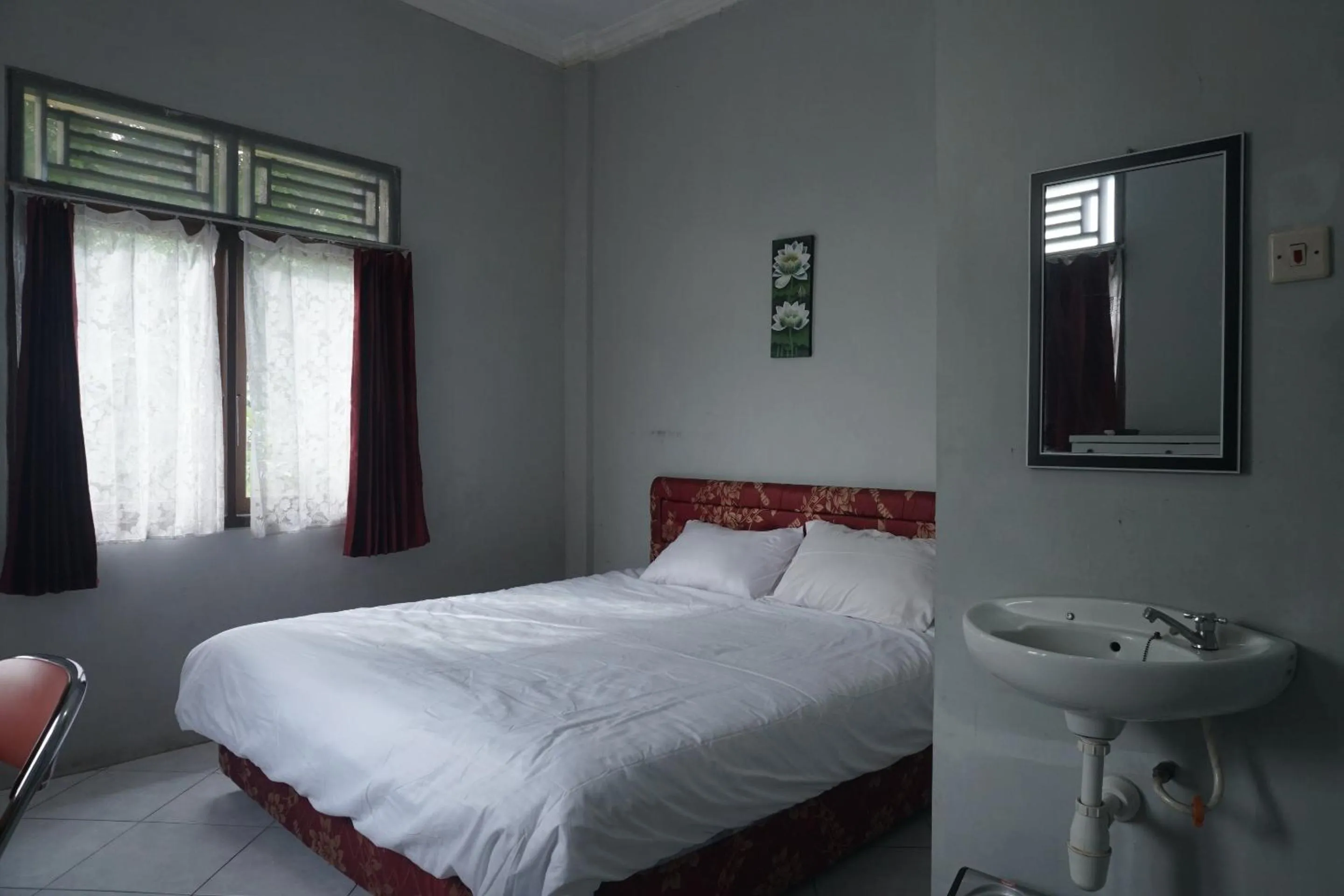 Bedroom in Hotel O Guest House Zidan 21
