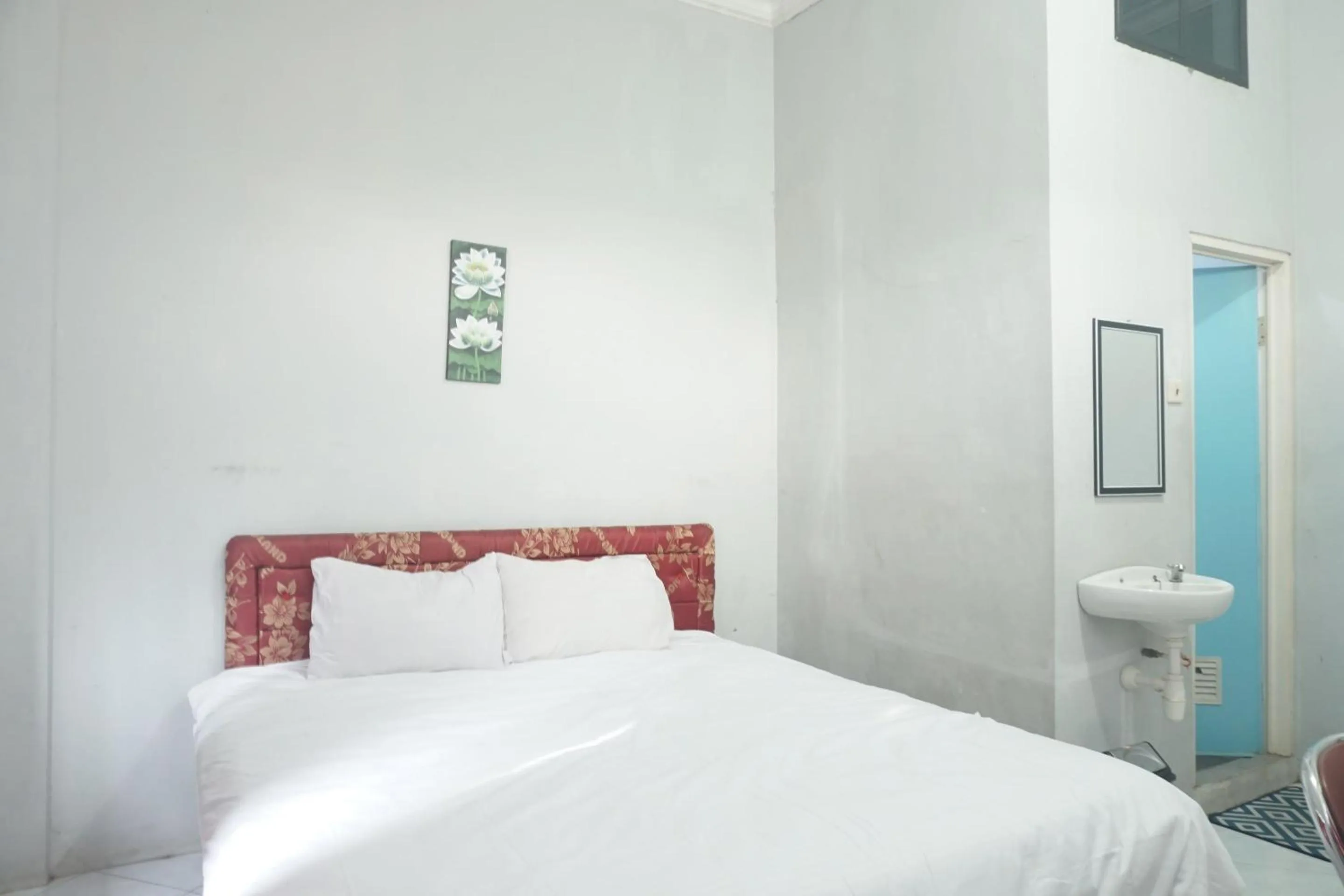 Bedroom in Hotel O Guest House Zidan 21