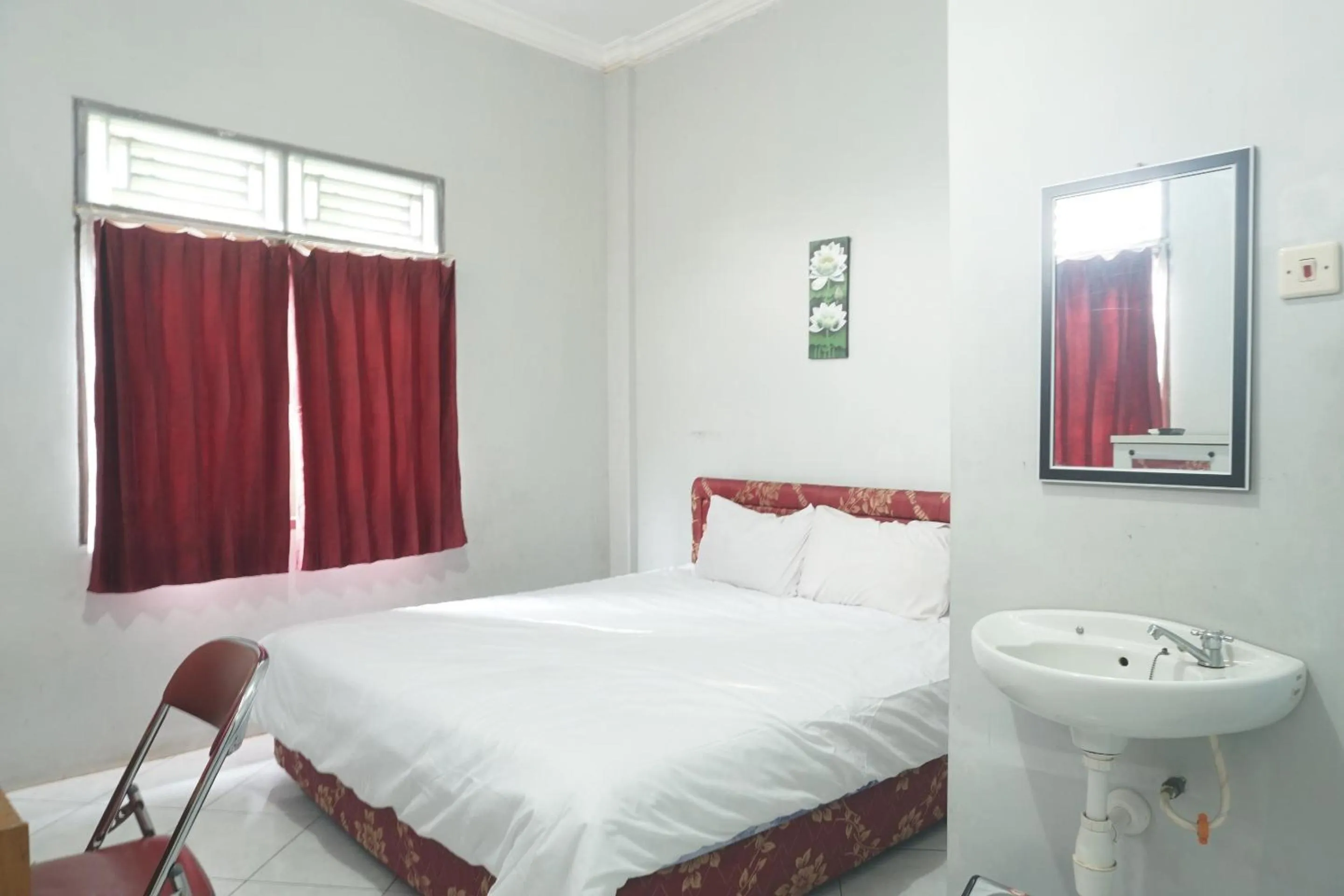 Bedroom in Hotel O Guest House Zidan 21