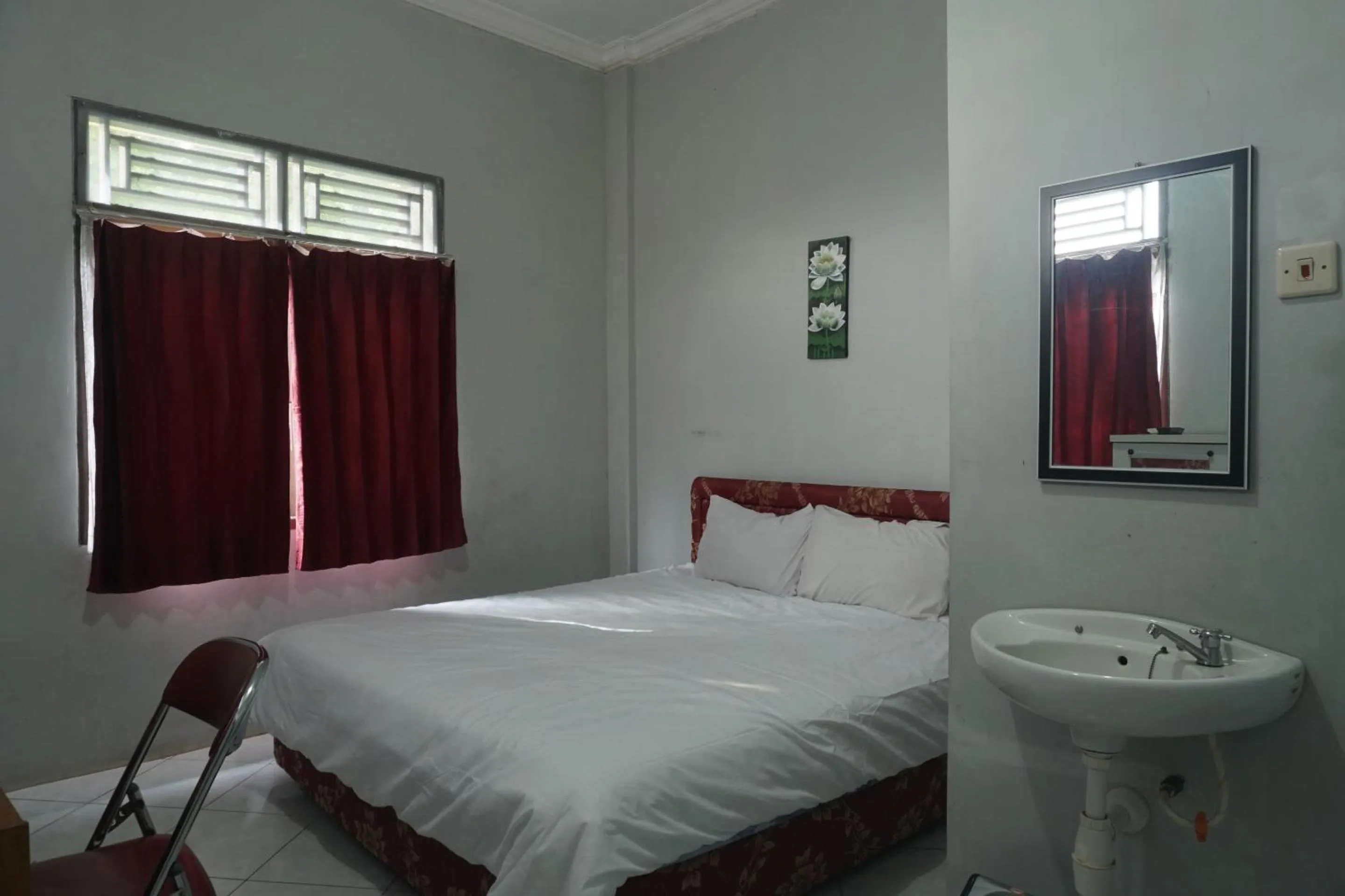 Bedroom in Hotel O Guest House Zidan 21