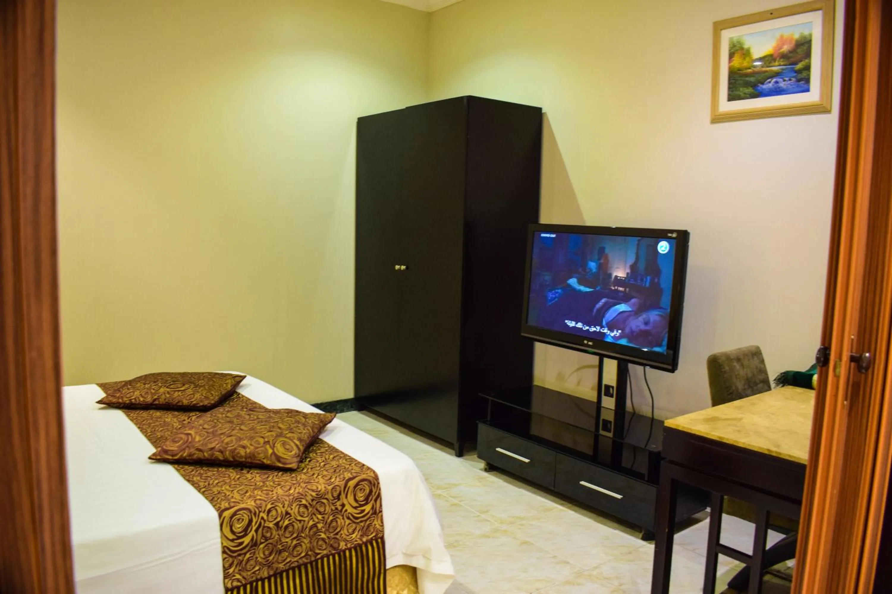 Bed in Arjan Qurtuba Served Apartments