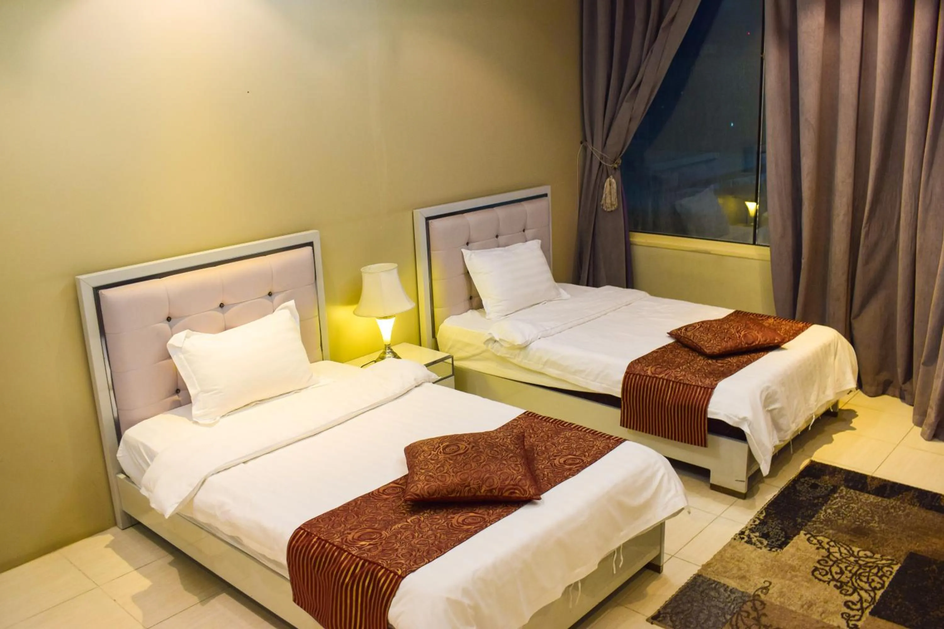 Bed in Arjan Qurtuba Served Apartments