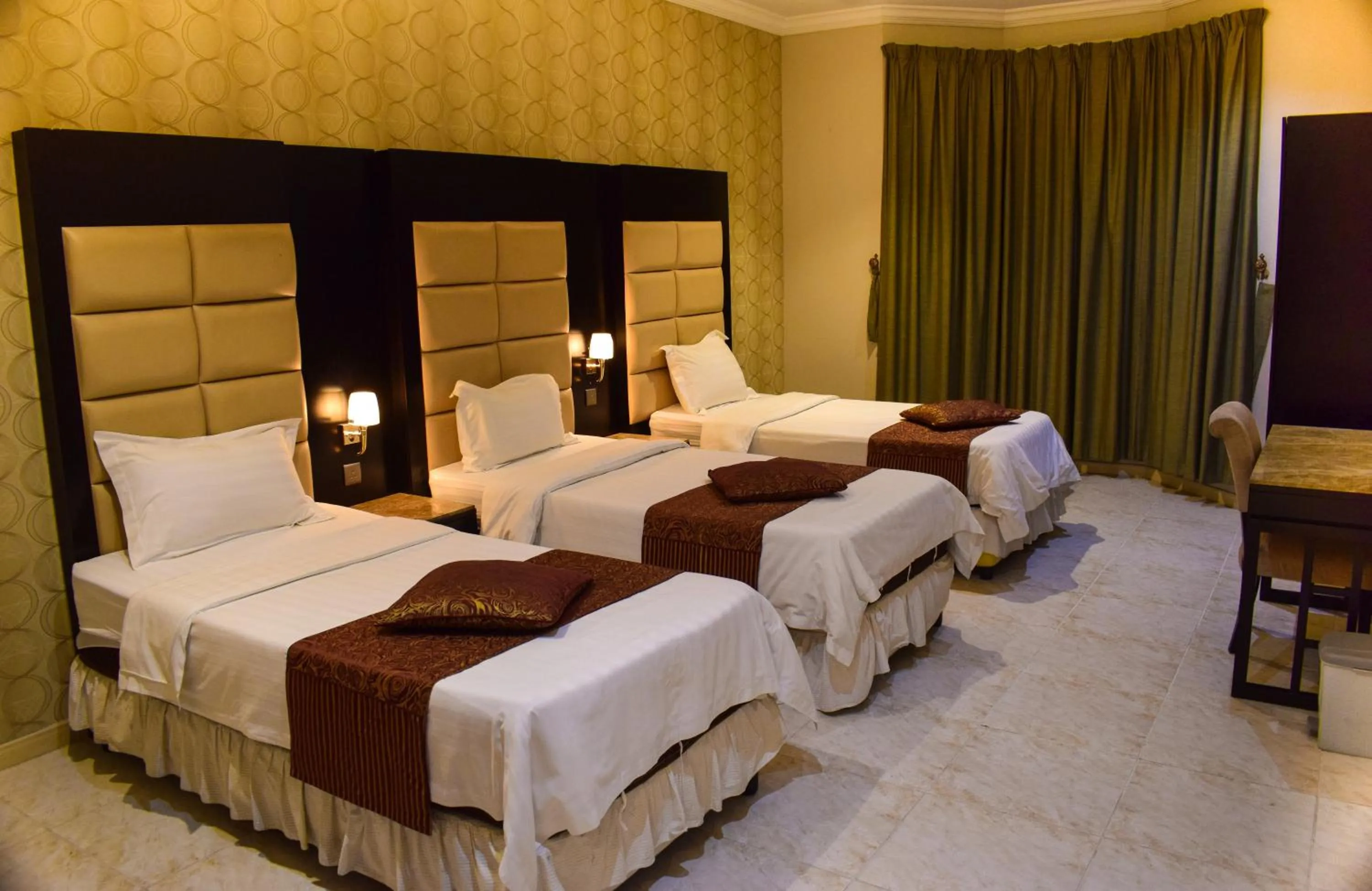 Bed in Arjan Qurtuba Served Apartments