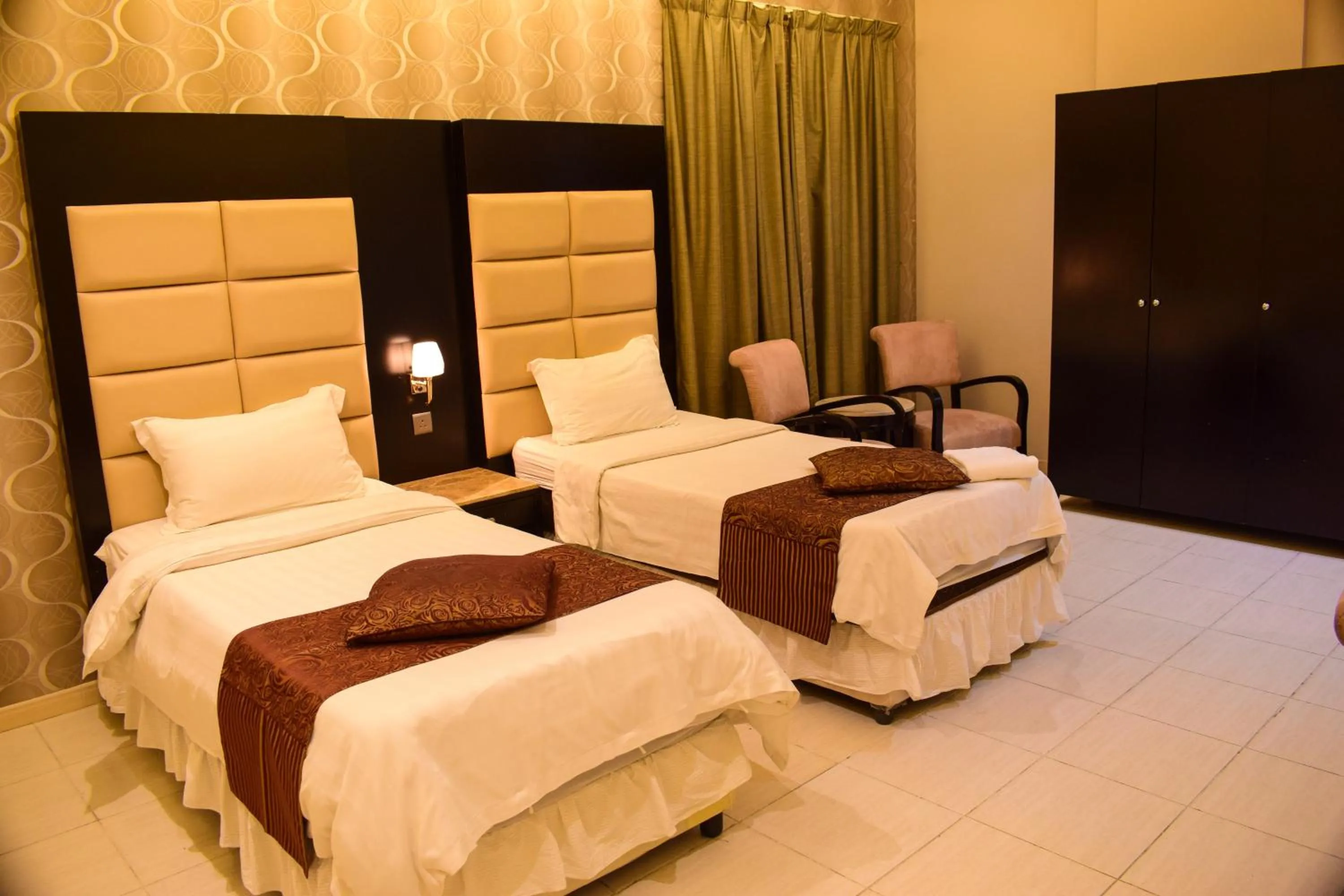 Bed in Arjan Qurtuba Served Apartments