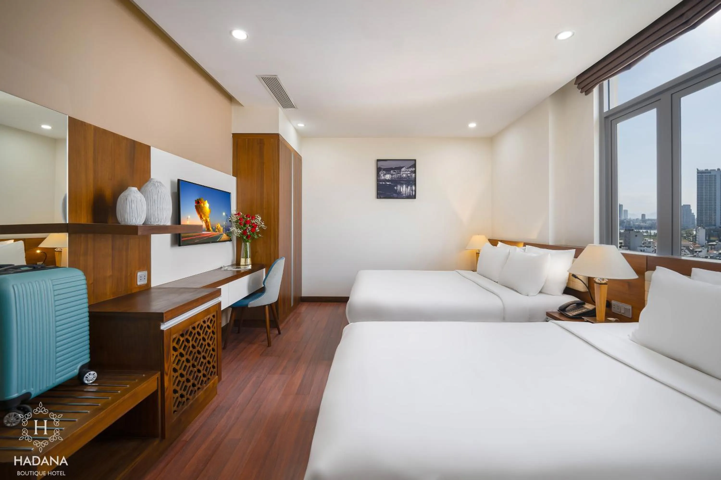 Communal lounge/ TV room, Bed in Hadana Boutique Hotel Danang