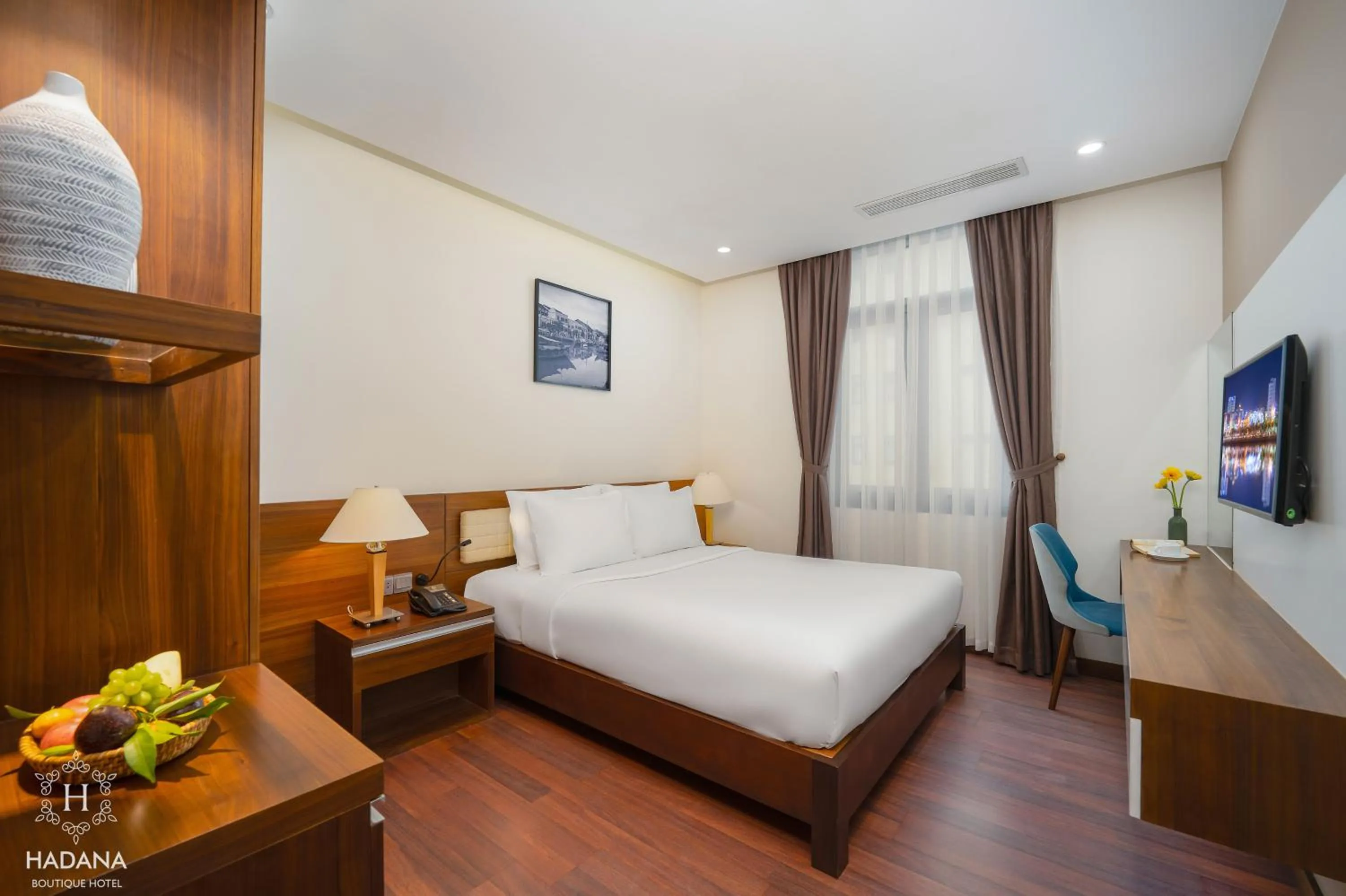 Communal lounge/ TV room, Bed in Hadana Boutique Hotel Danang