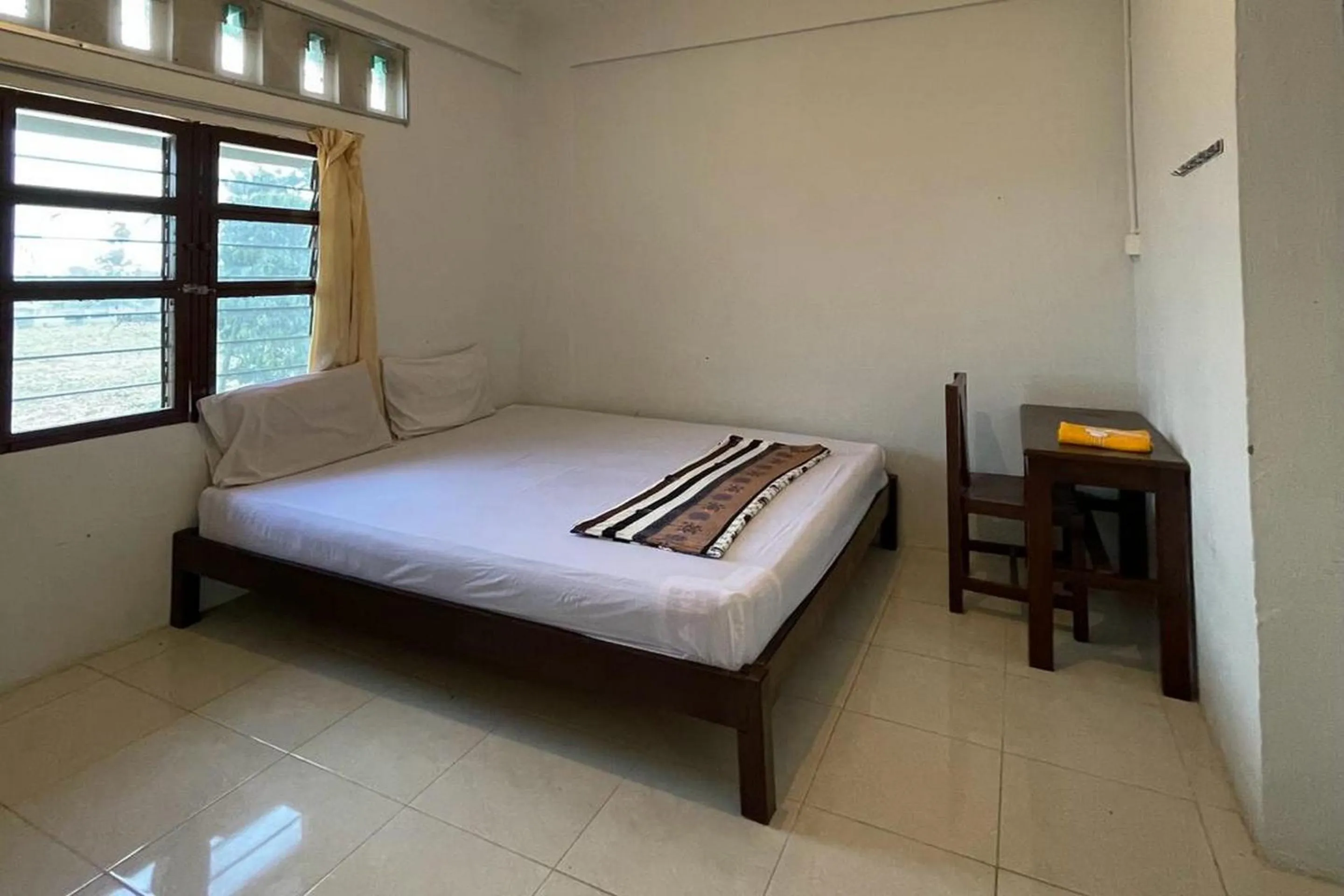 Bedroom in Hotel O Saril Riverside HomestayNearLapangan Musara Alun