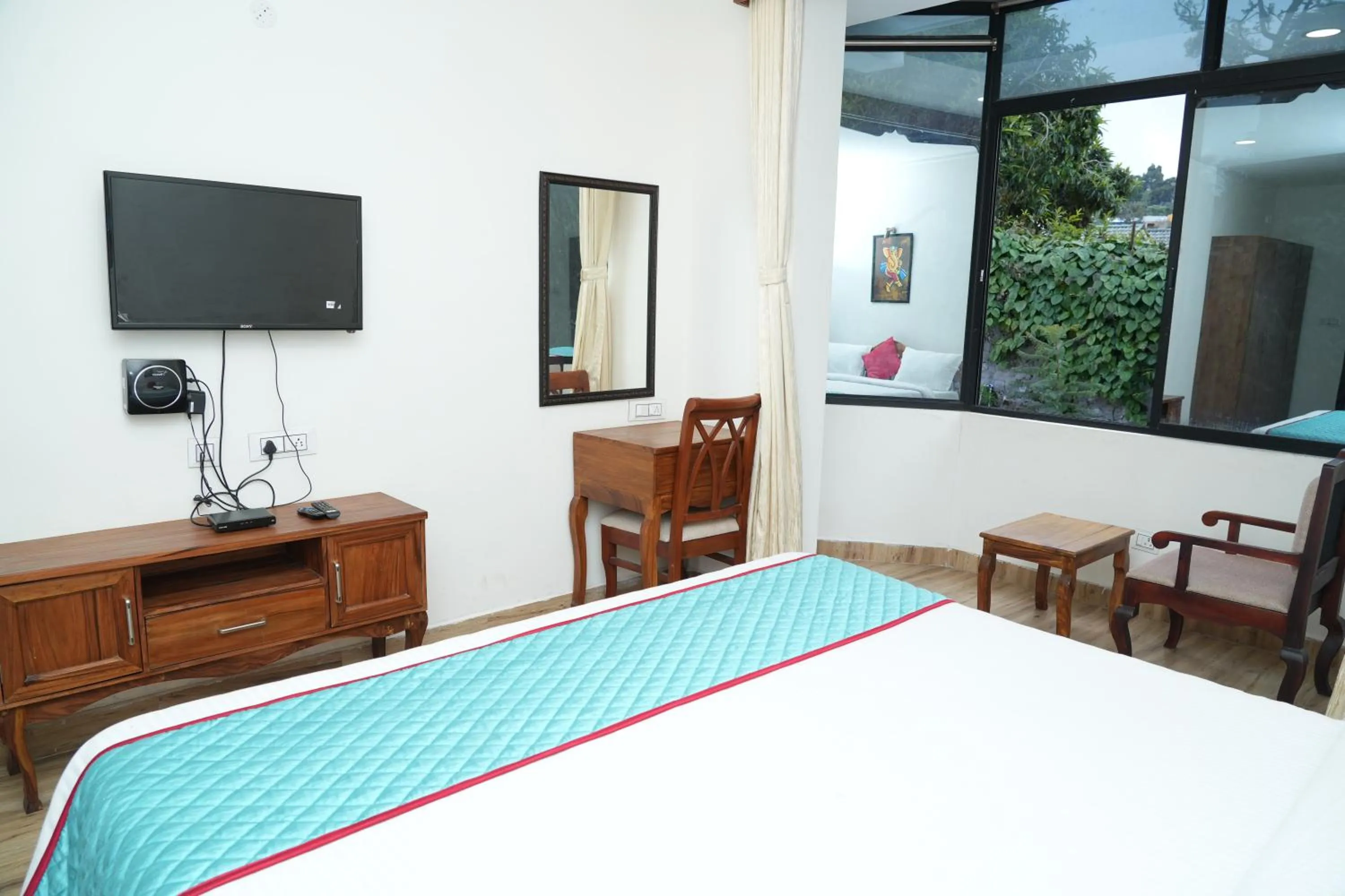 Bed in Vetrivel International by Brown Tree Resorts