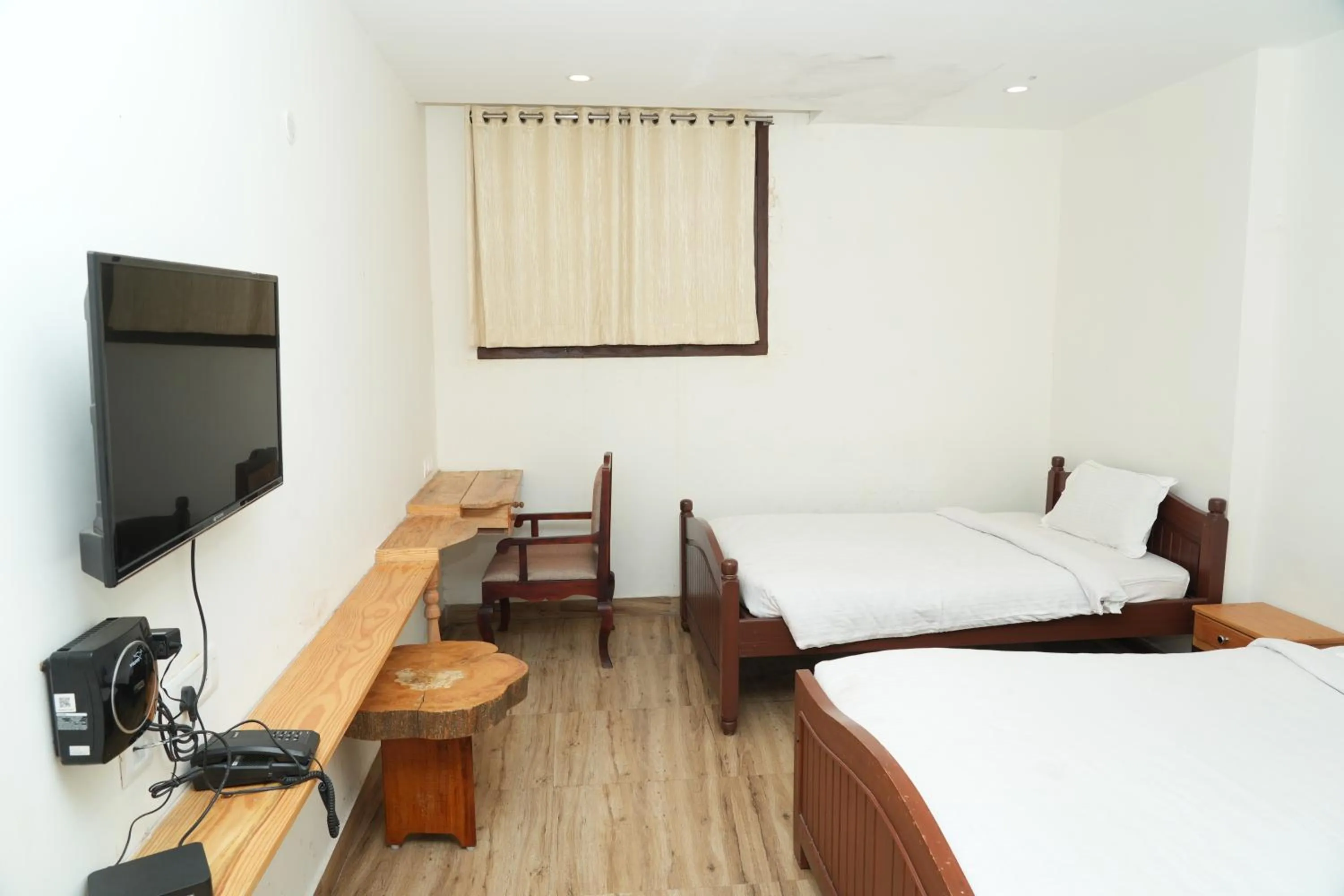 Bed in Vetrivel International by Brown Tree Resorts