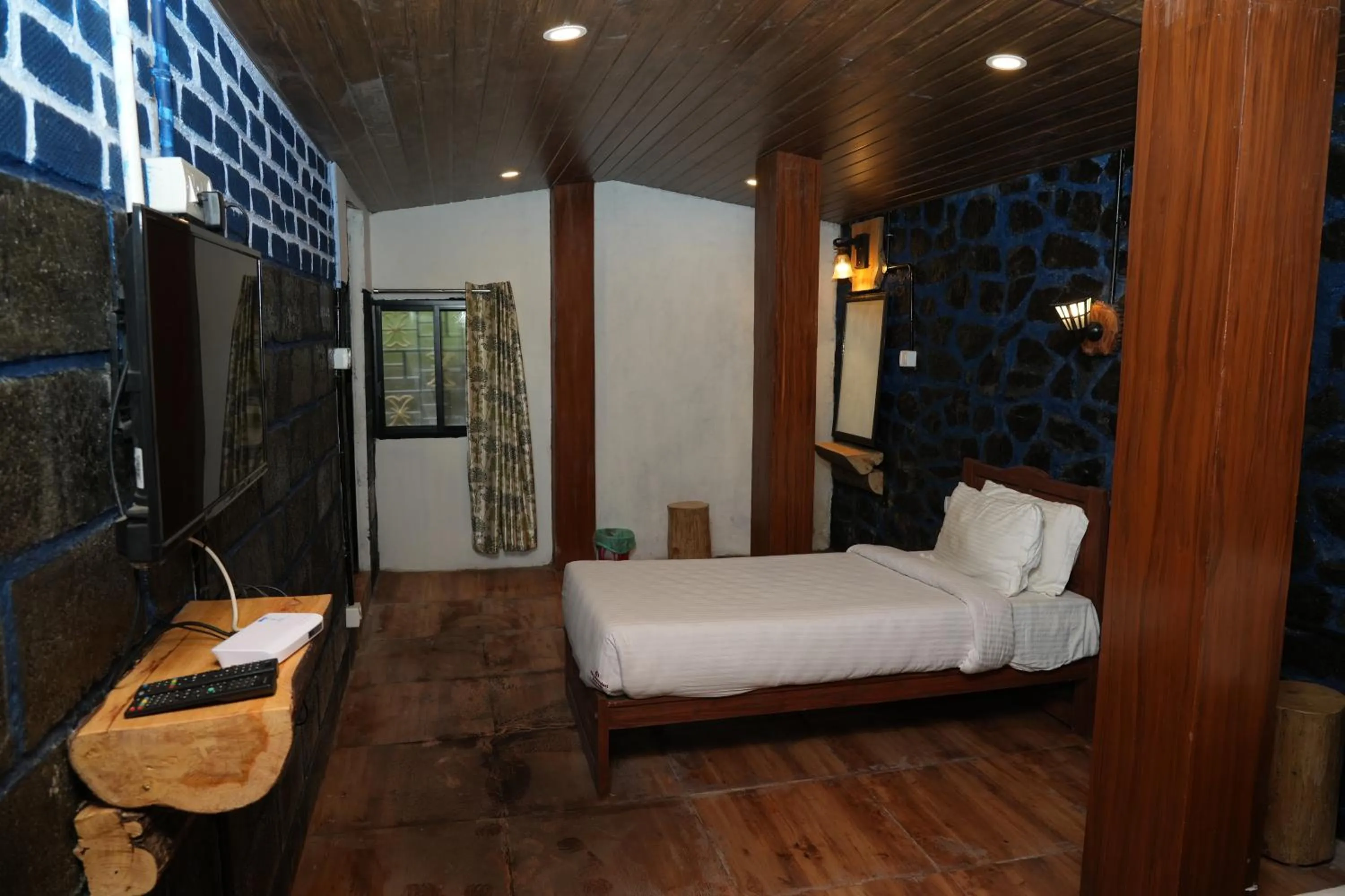 Bed in Vetrivel International by Brown Tree Resorts