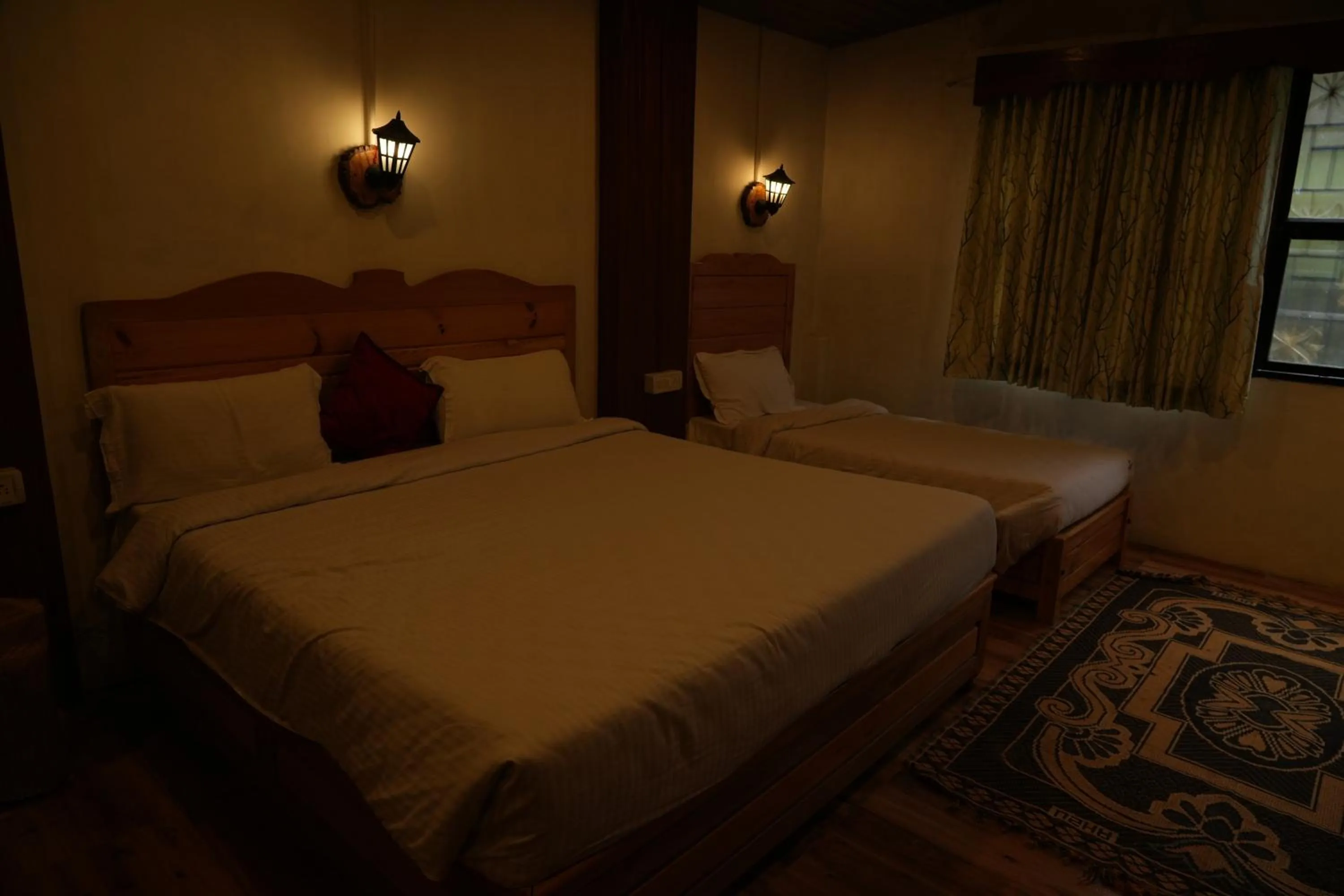 Bed in Vetrivel International by Brown Tree Resorts