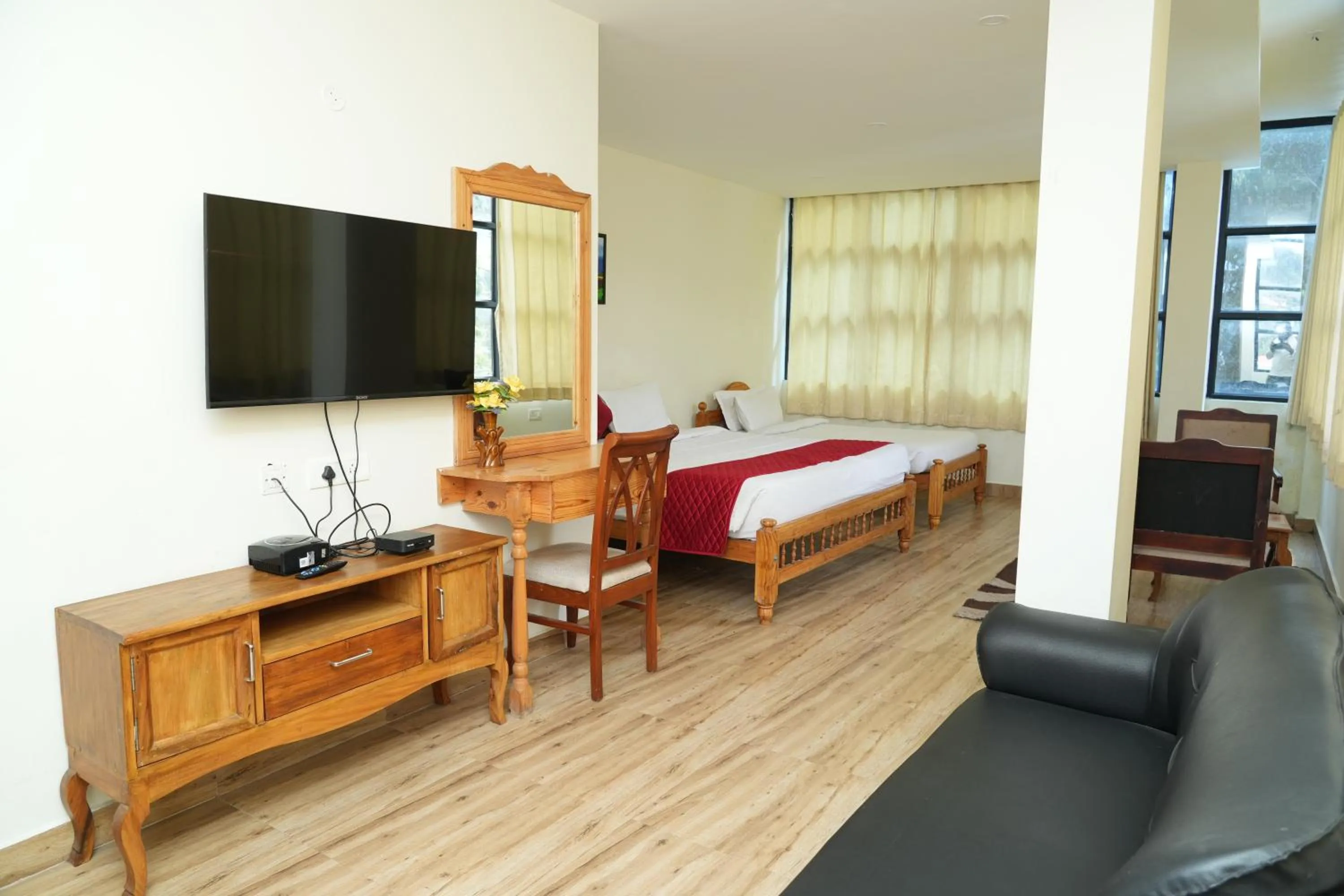 Bed in Vetrivel International by Brown Tree Resorts