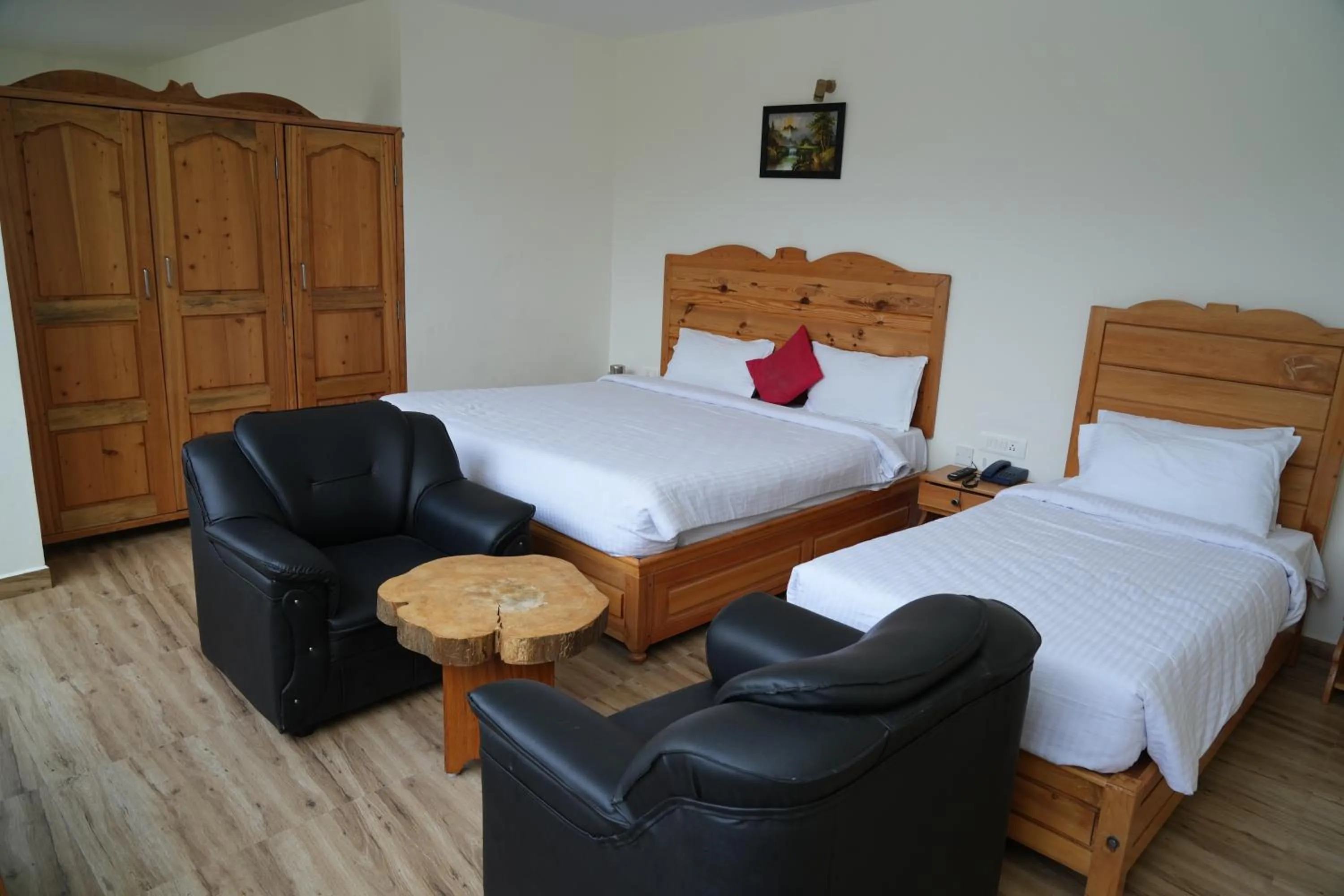 Bed in Vetrivel International by Brown Tree Resorts